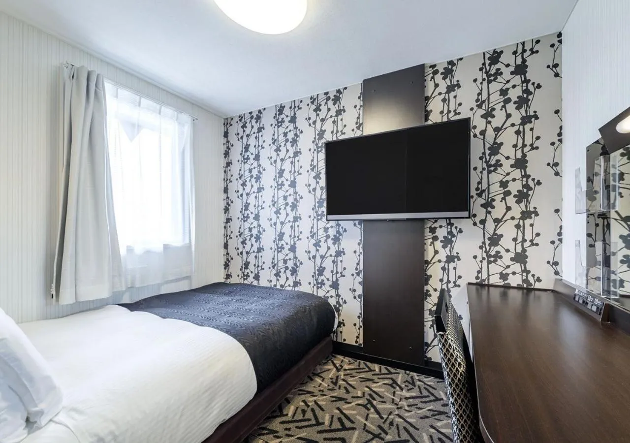 Photo of the whole room, Bed in APA Hotel Miyazaki Nobeoka Ekimae