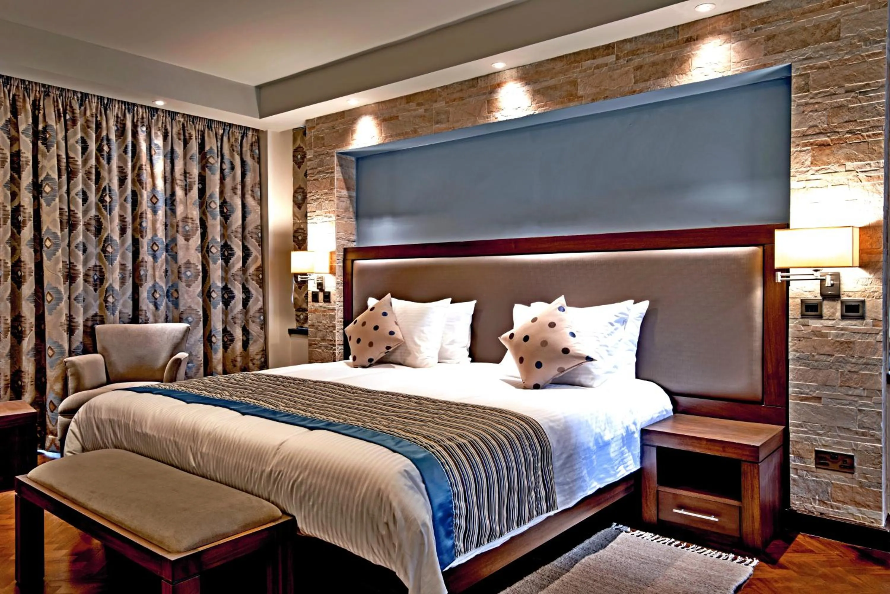Bed in Magna Hotel and Suites