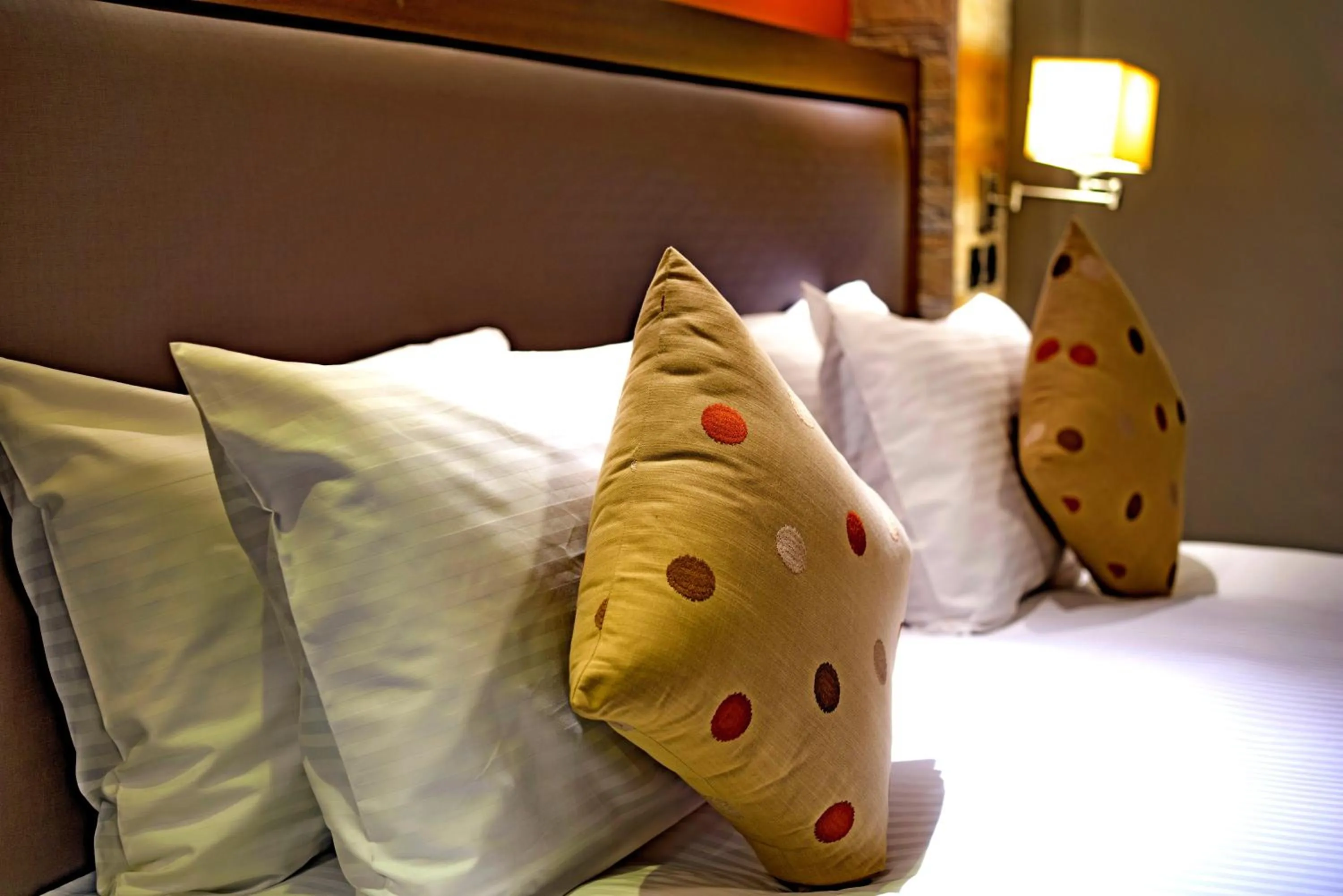 Bed in Magna Hotel and Suites