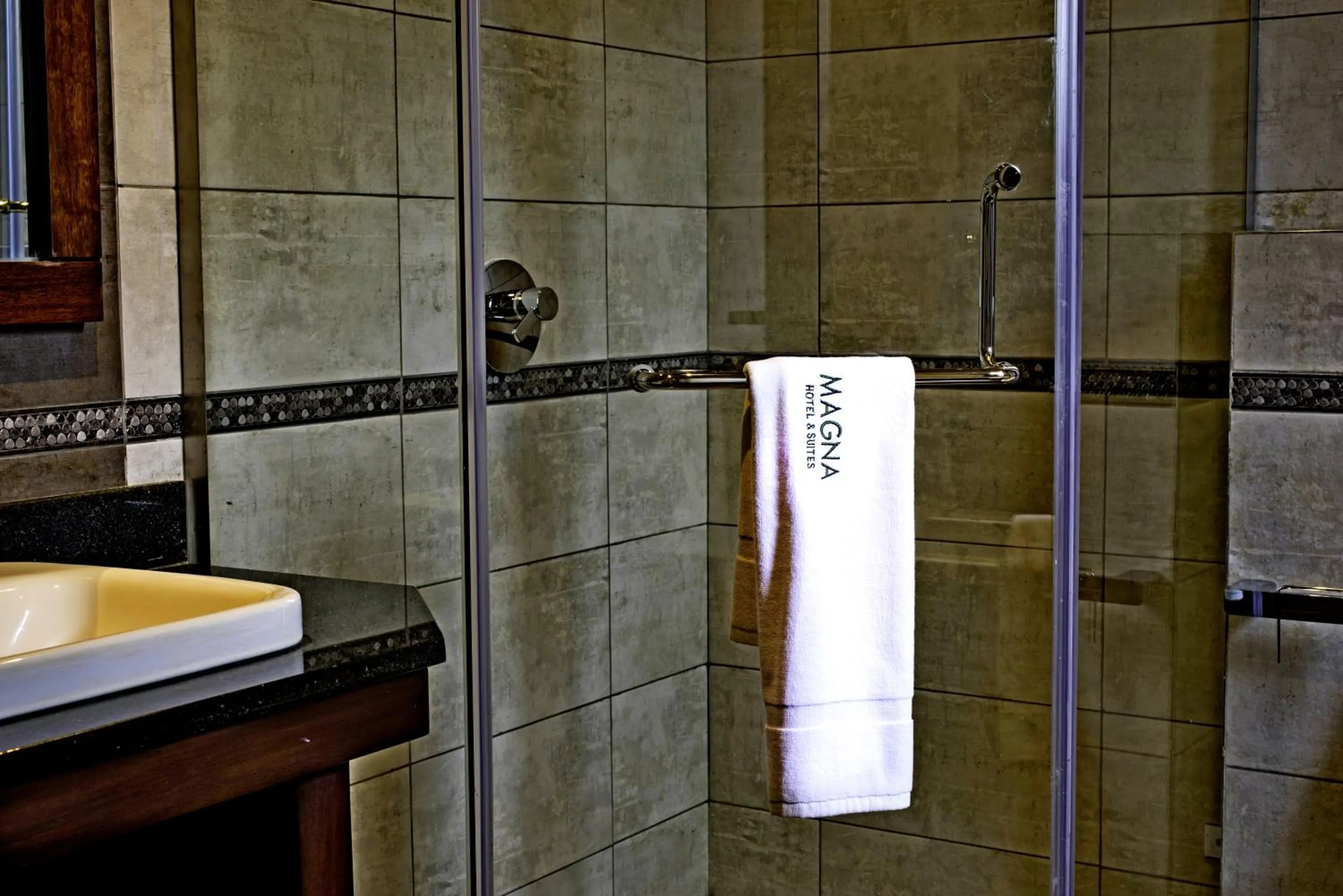 Bathroom in Magna Hotel and Suites