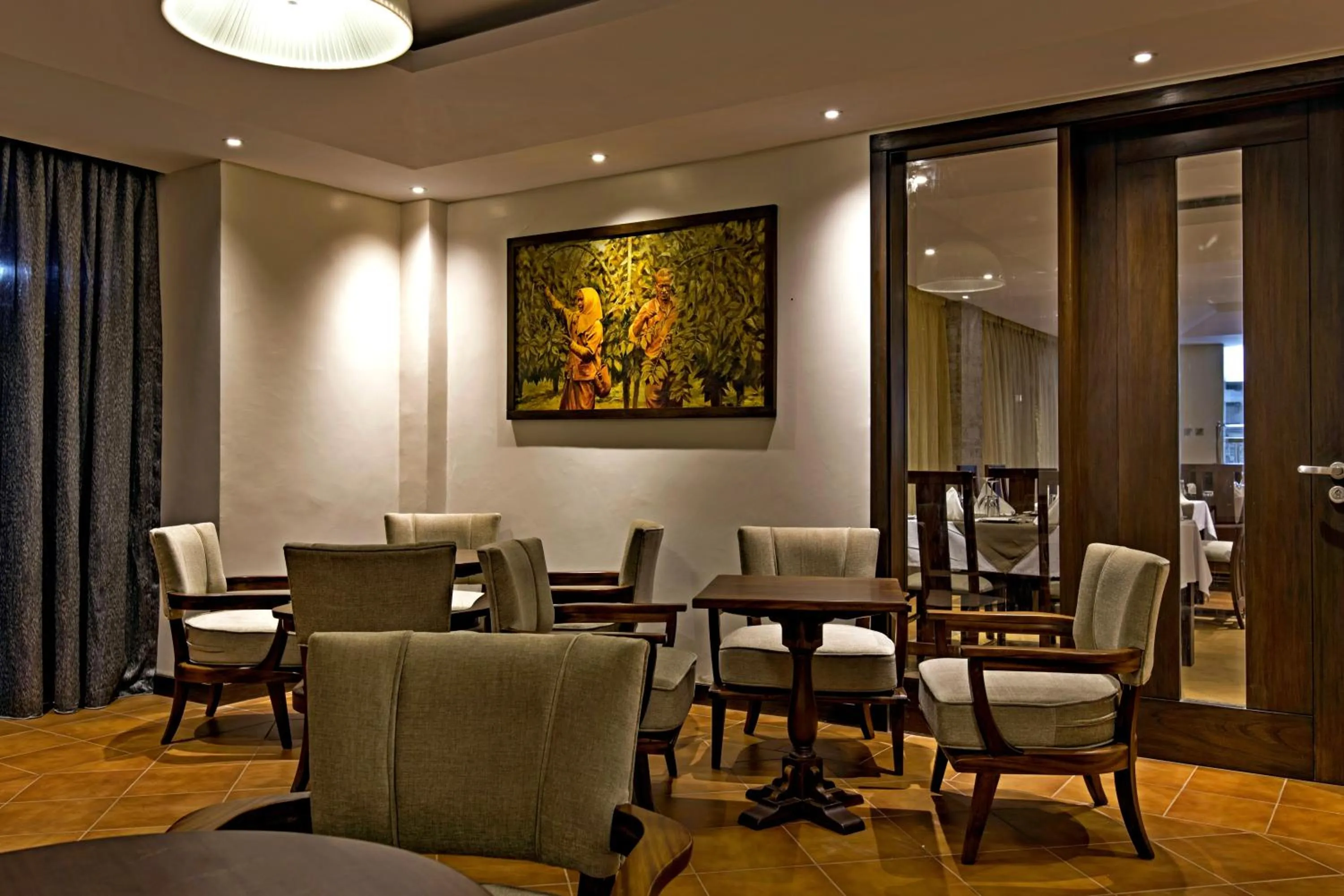 Communal lounge/ TV room, Restaurant/Places to Eat in Magna Hotel and Suites