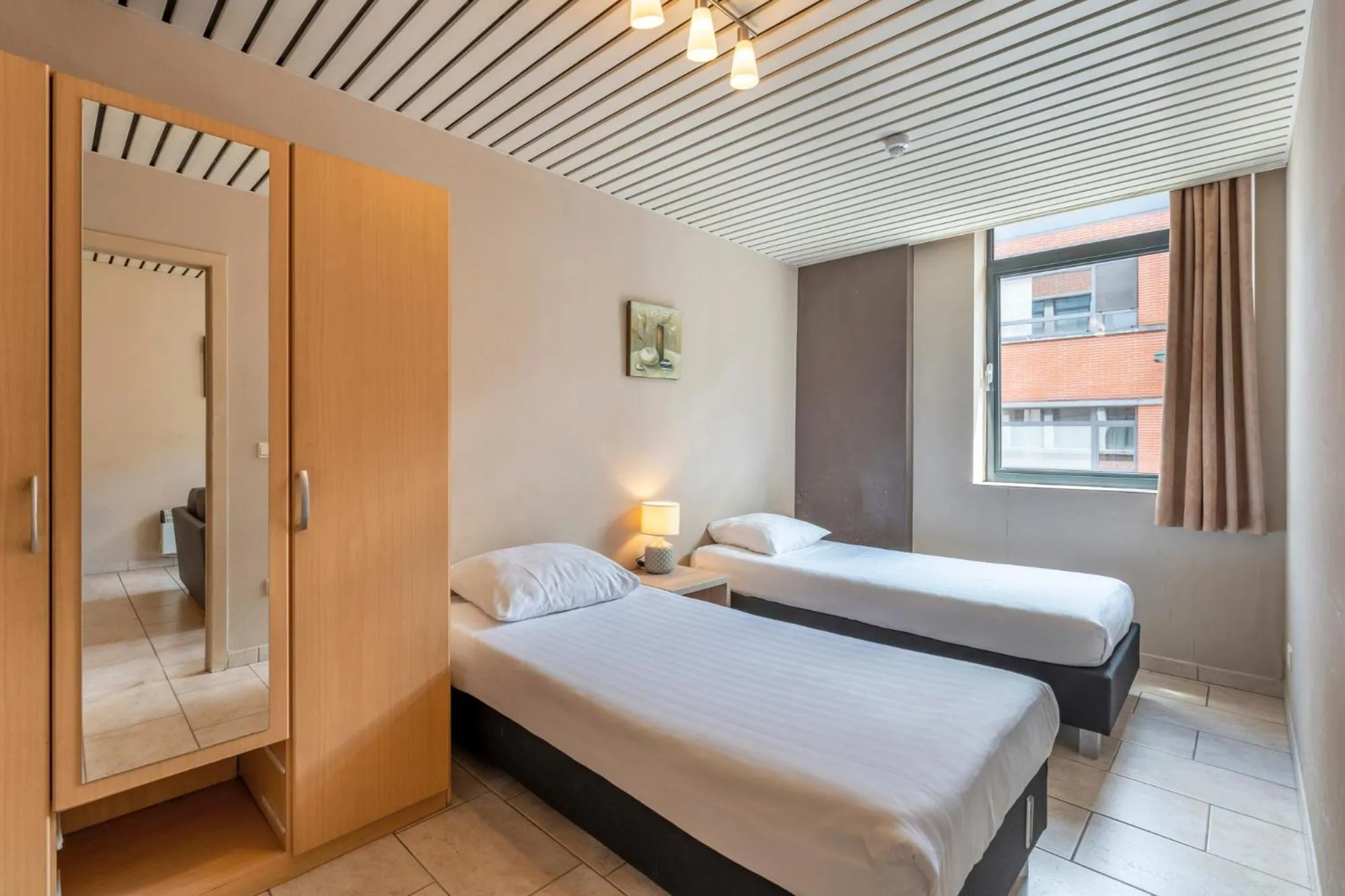 Bed in Condo Gardens Brussels