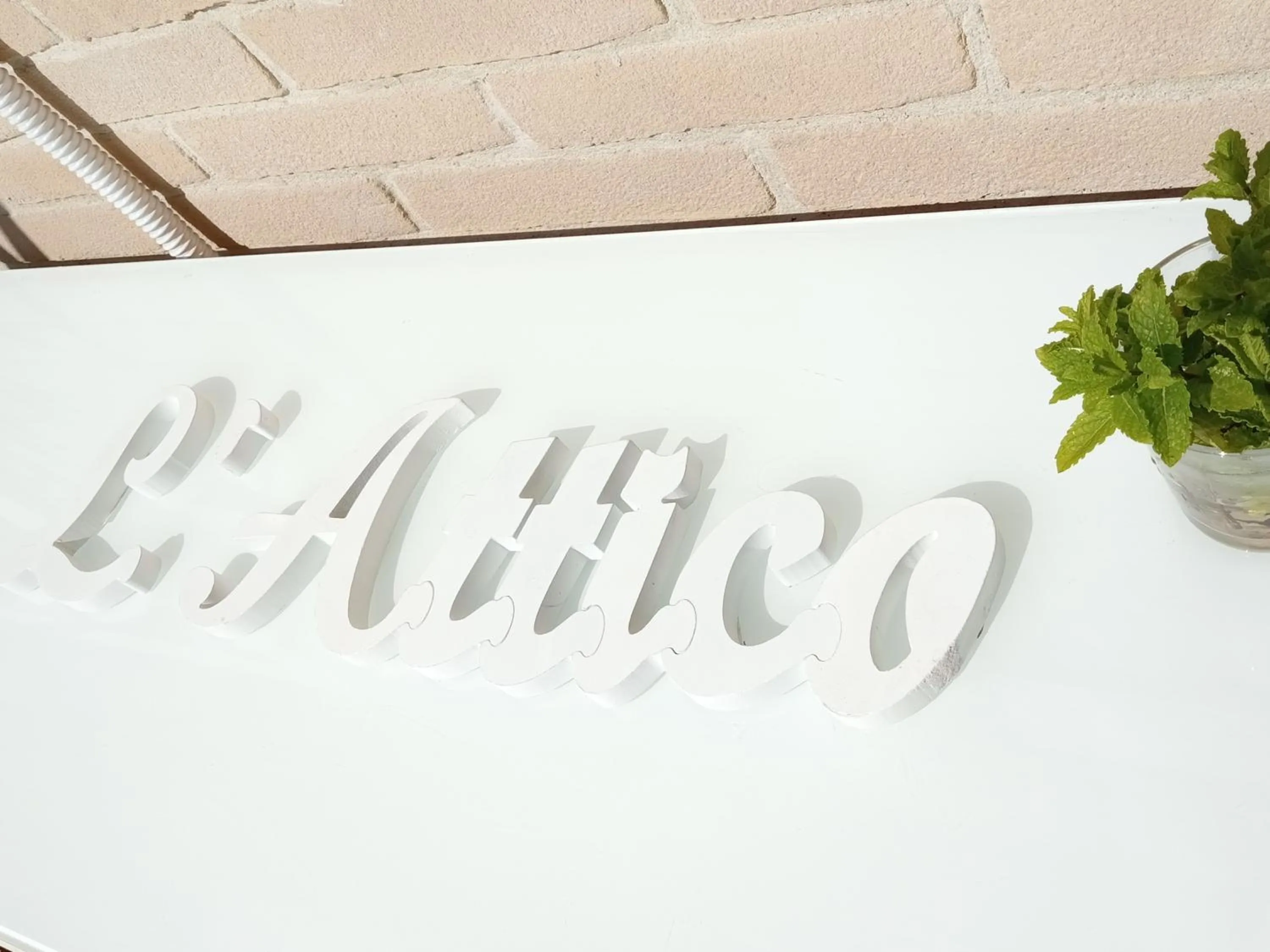 Text overlay in L'ATTICO Bed & Breakfast