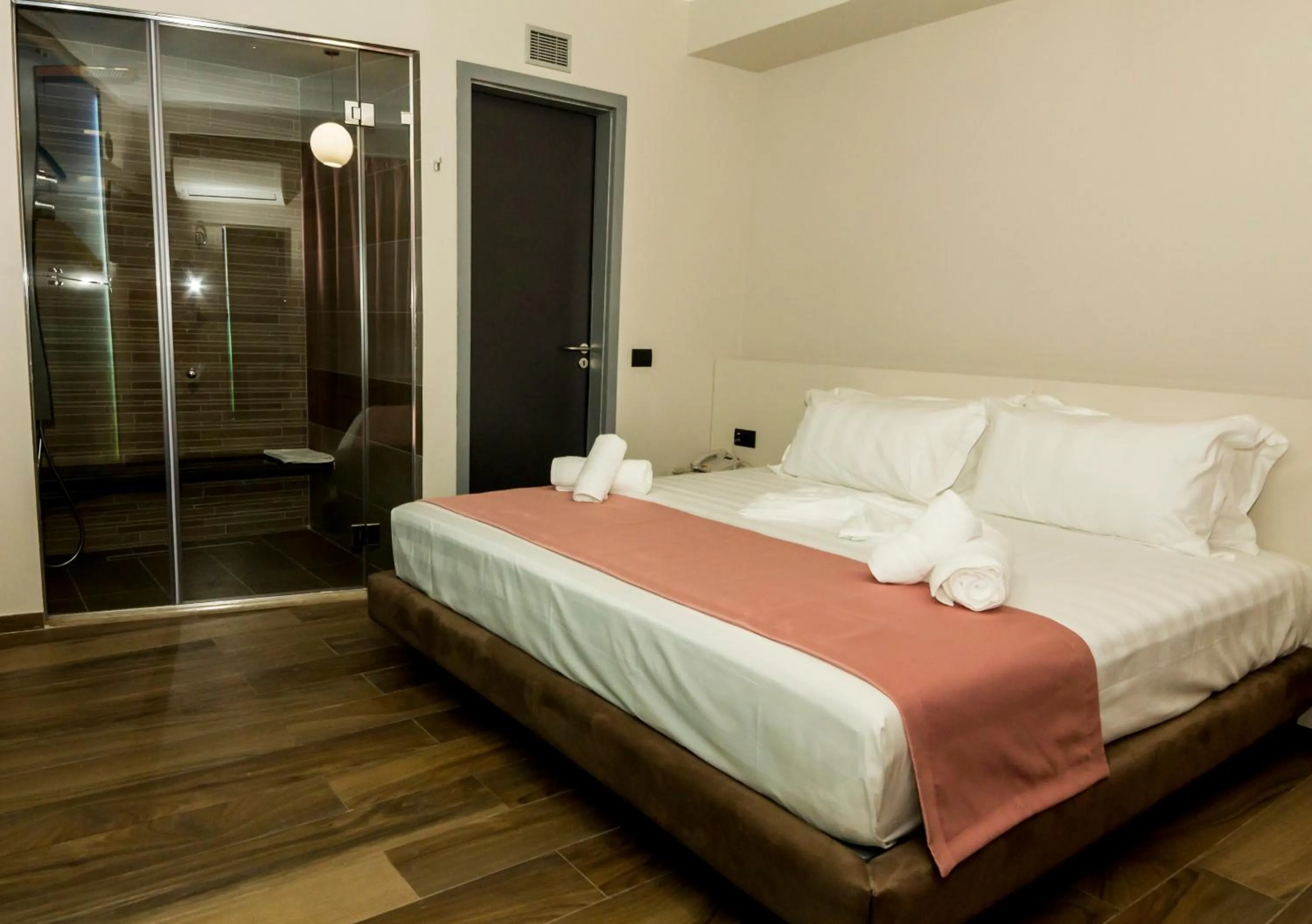 Bed in Hotel Pandora Residence