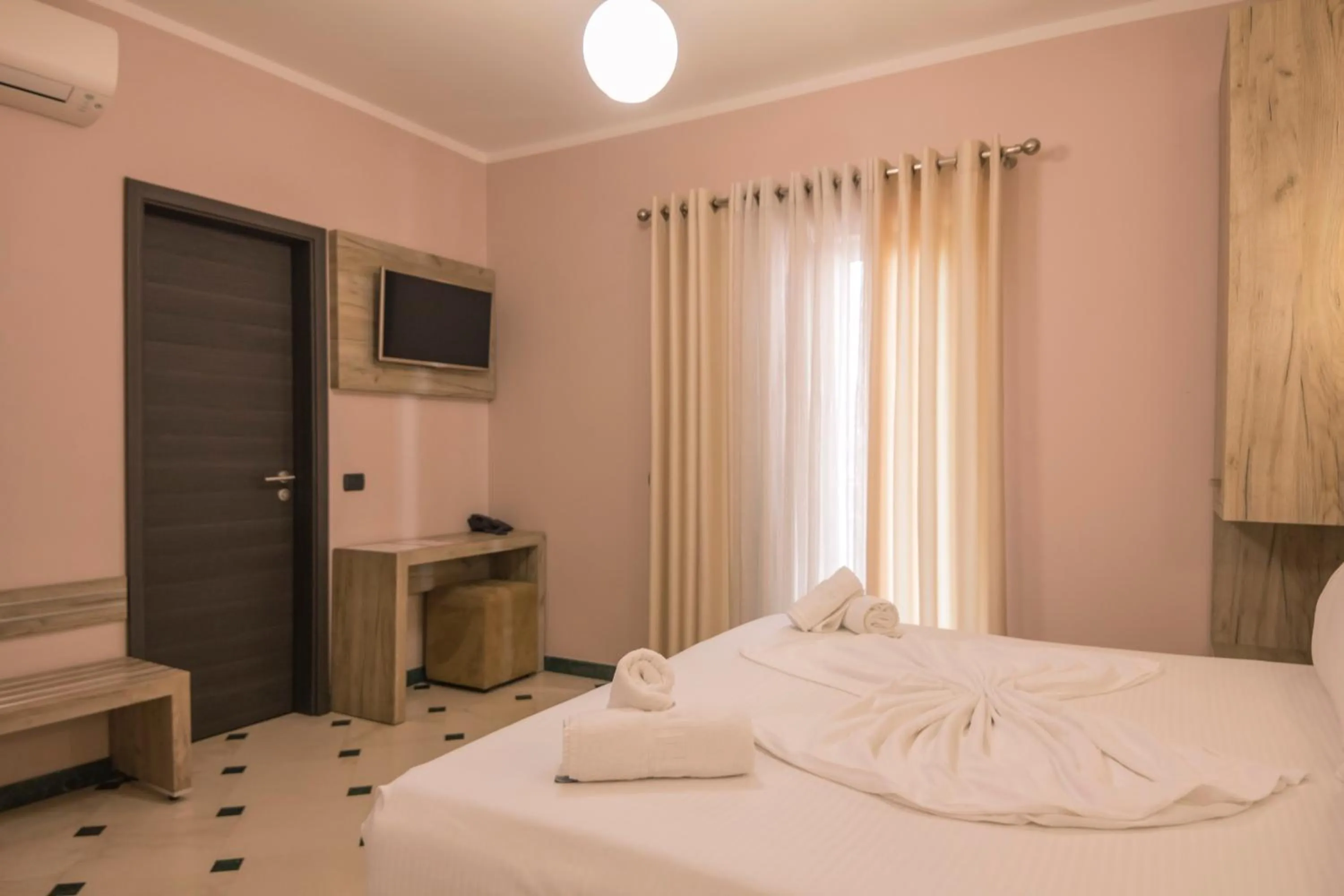 Bed in Hotel Pandora Residence