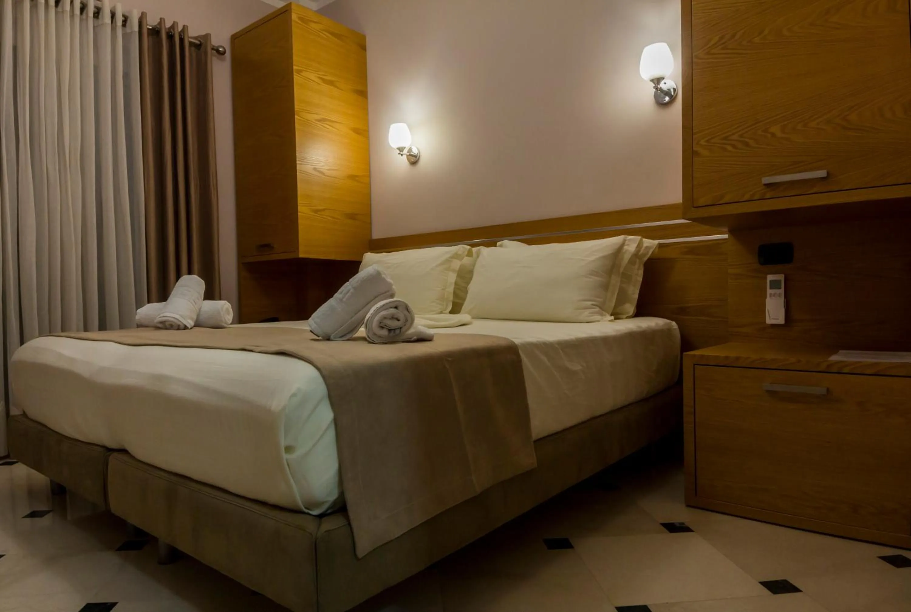 Bed in Hotel Pandora Residence