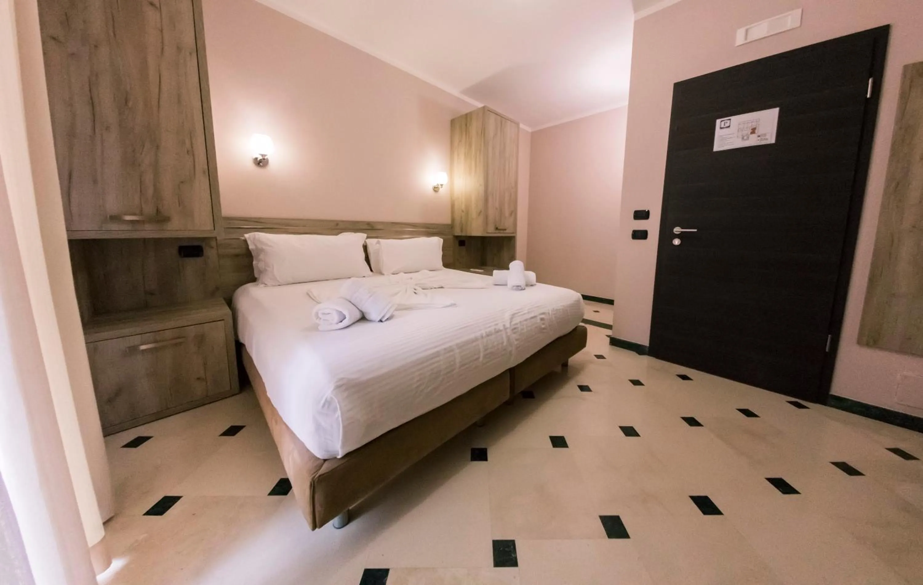 Bed in Hotel Pandora Residence