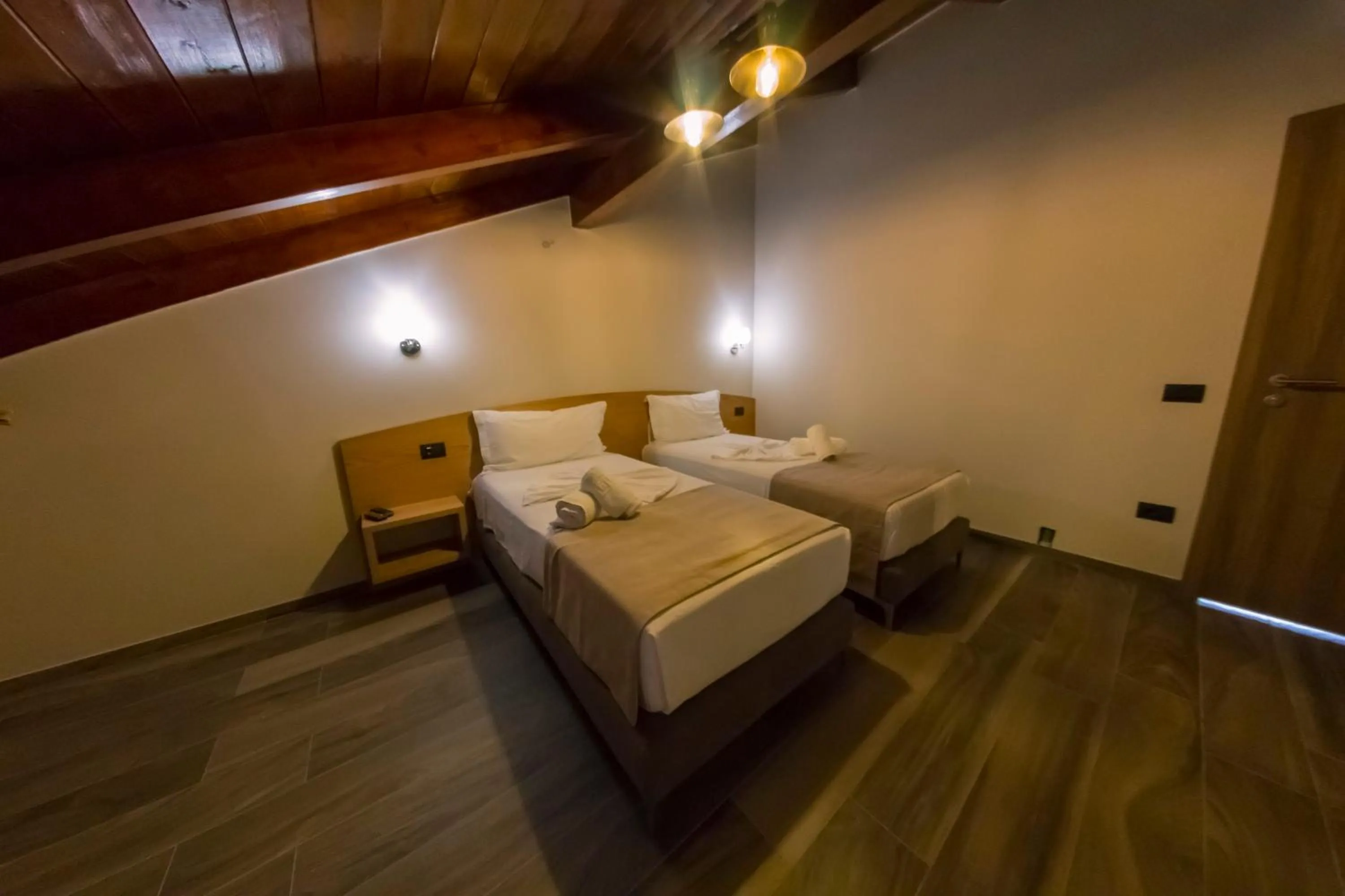 Bed in Hotel Pandora Residence