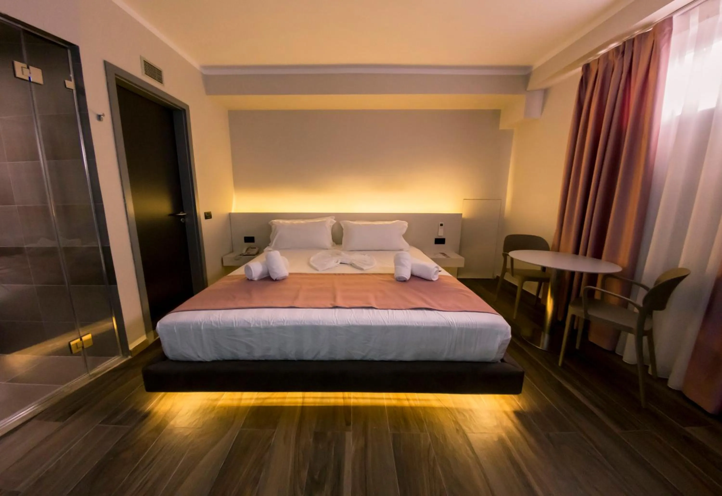 Bed in Hotel Pandora Residence