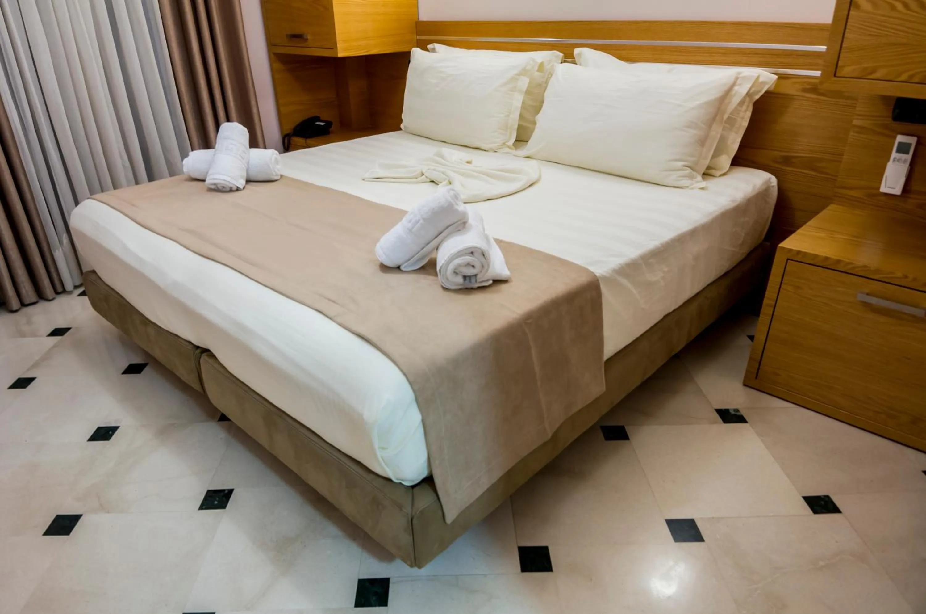 Bed in Hotel Pandora Residence