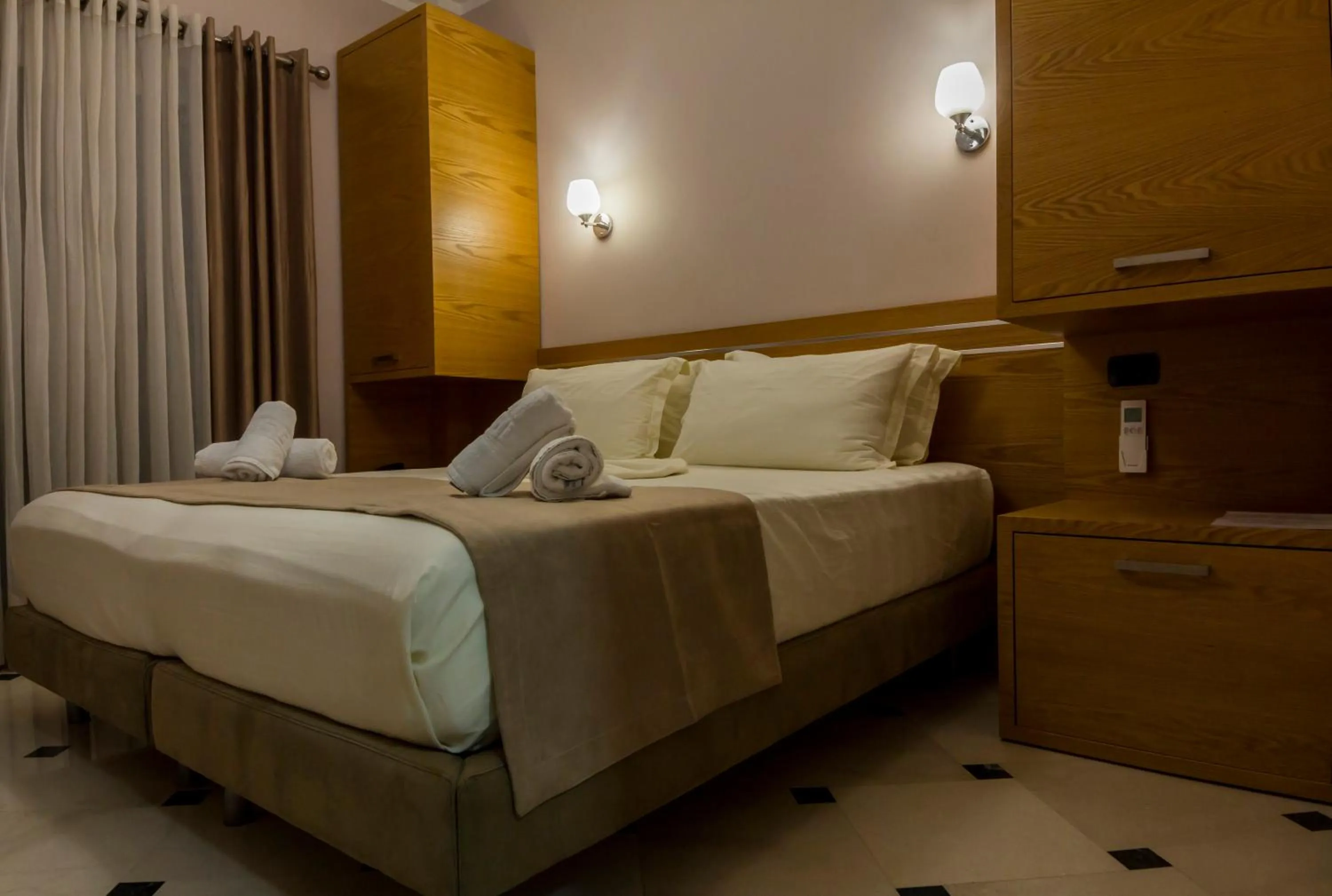 Bed in Hotel Pandora Residence