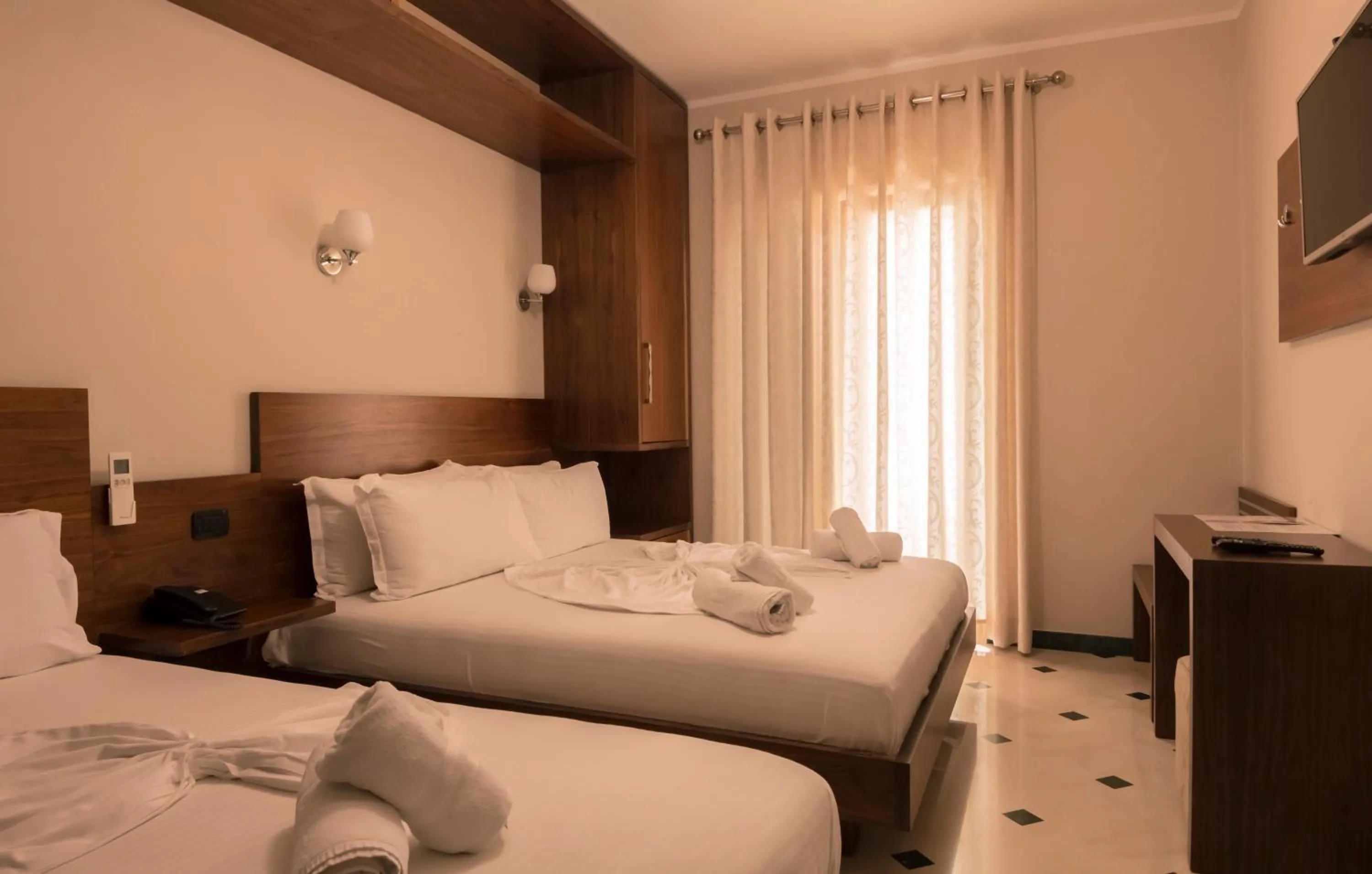 Bed in Hotel Pandora Residence