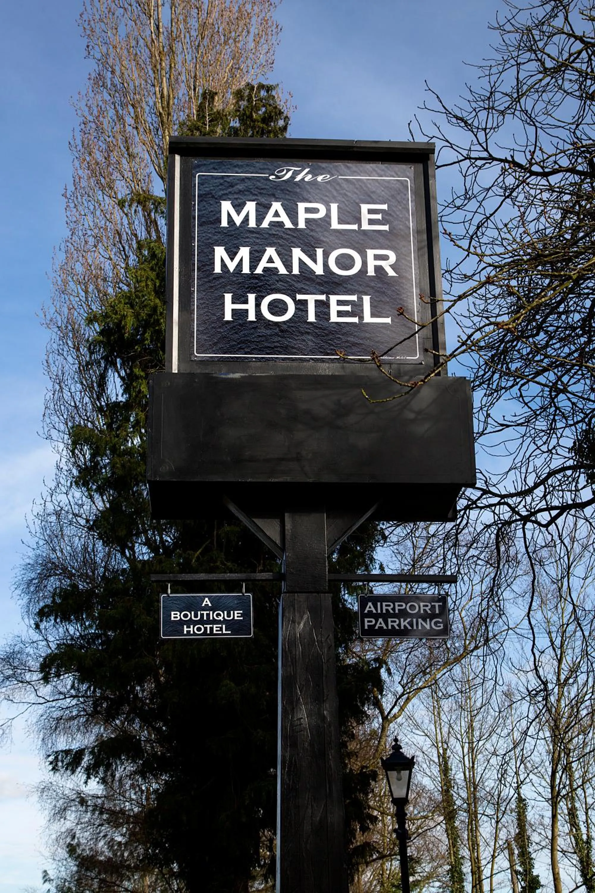 Property logo or sign in The Maple Manor Hotel