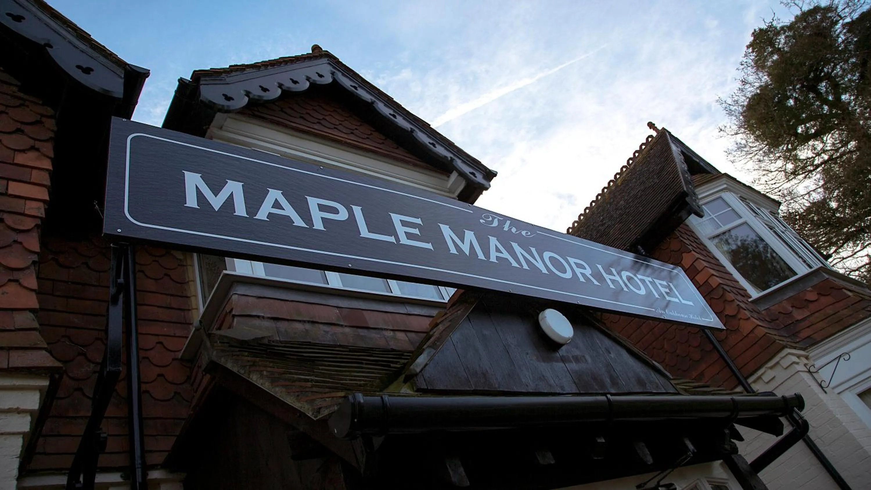 Property logo or sign in The Maple Manor Hotel