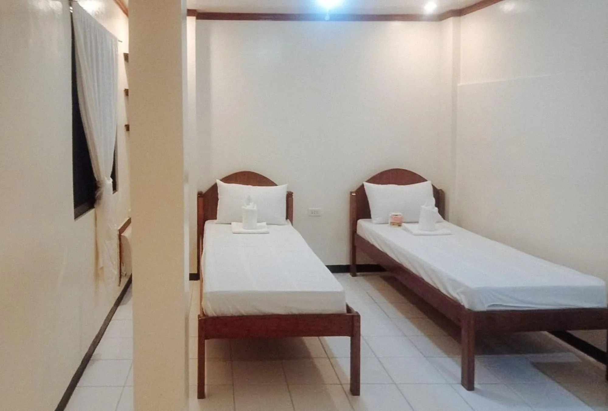 Bed in RedDoorz at Amphibi-ko Resort Palawan