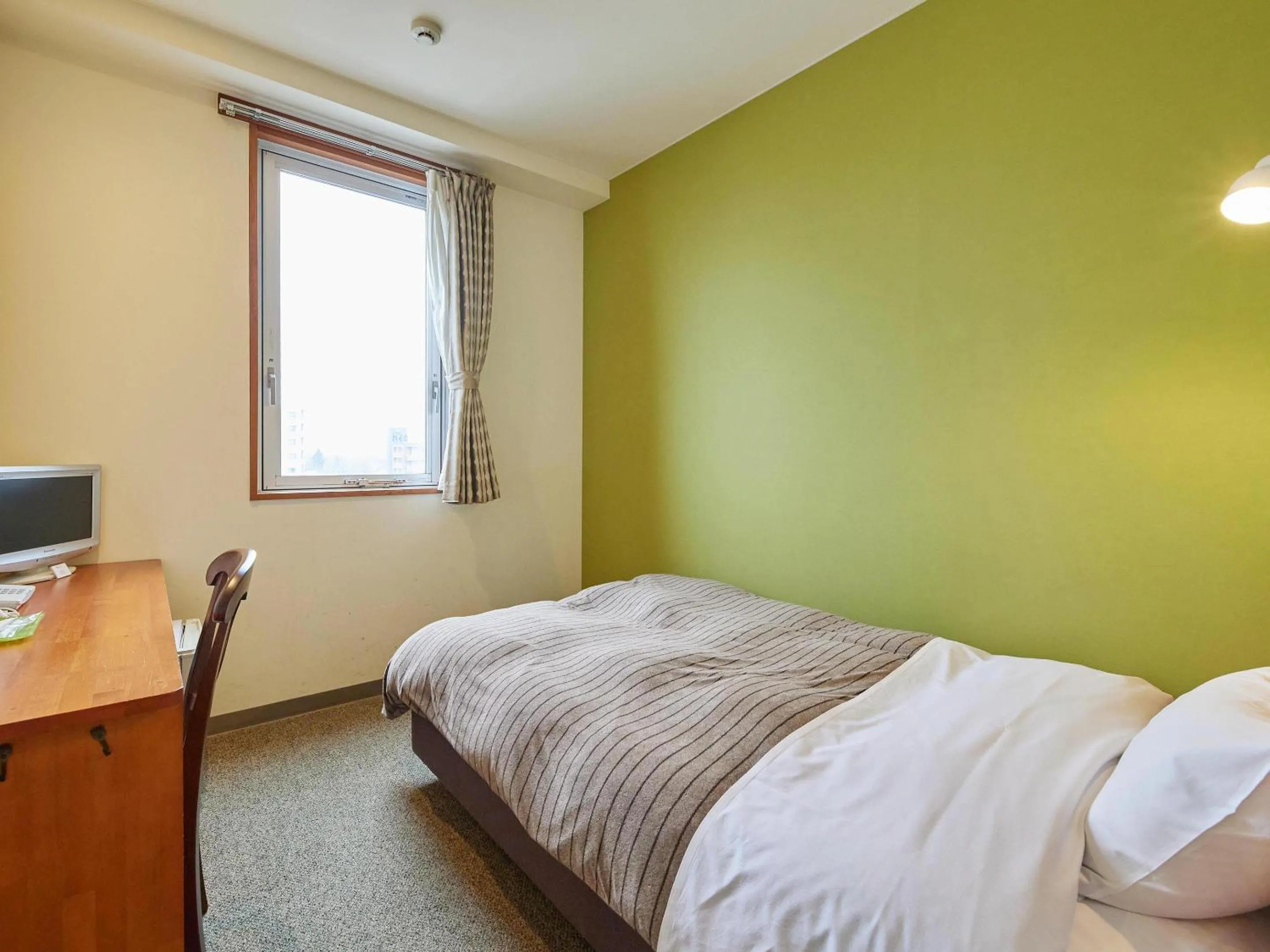 Bed in Kumagaya Royal Hotel Suzuki