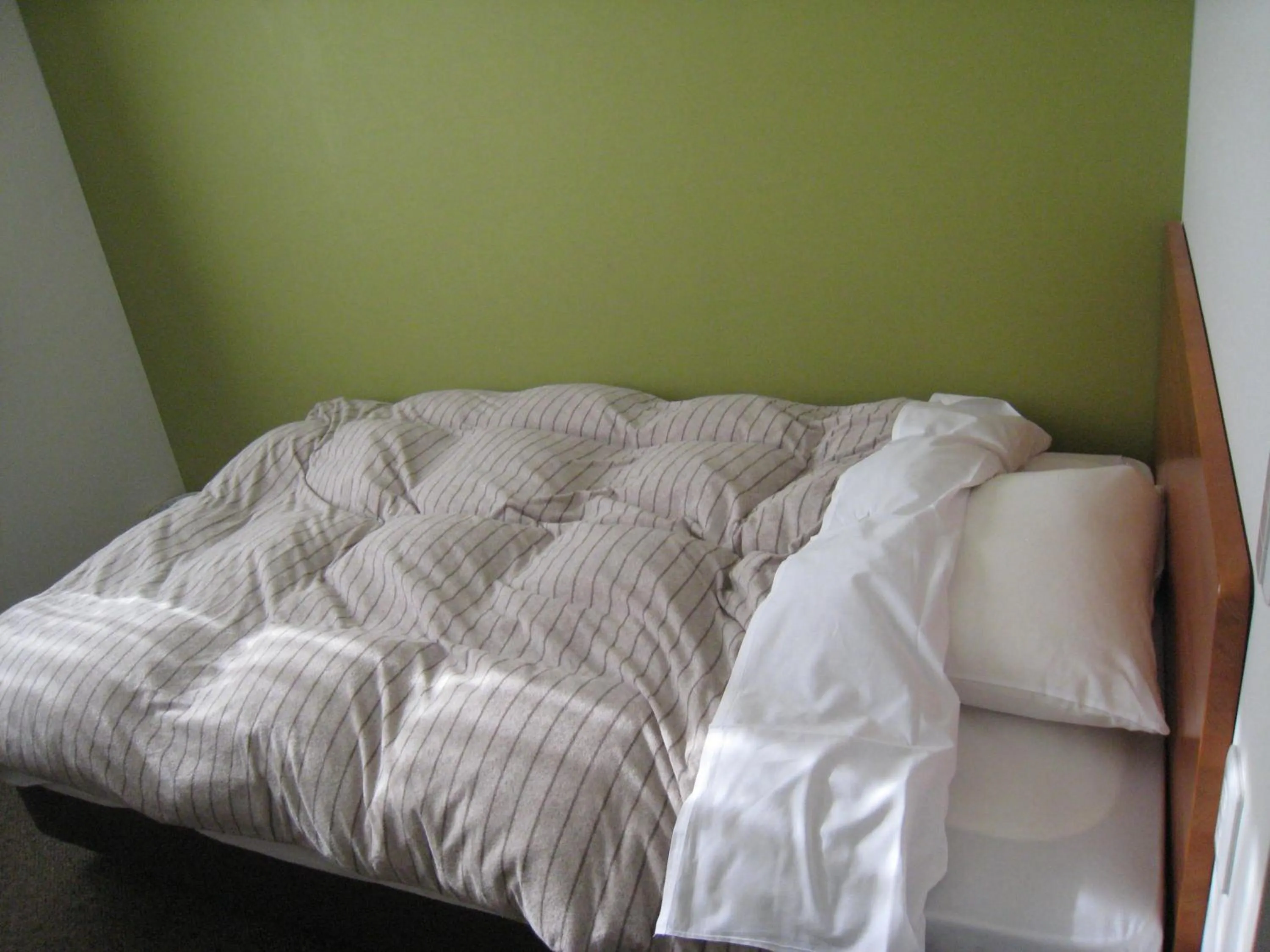 Bed in Kumagaya Royal Hotel Suzuki