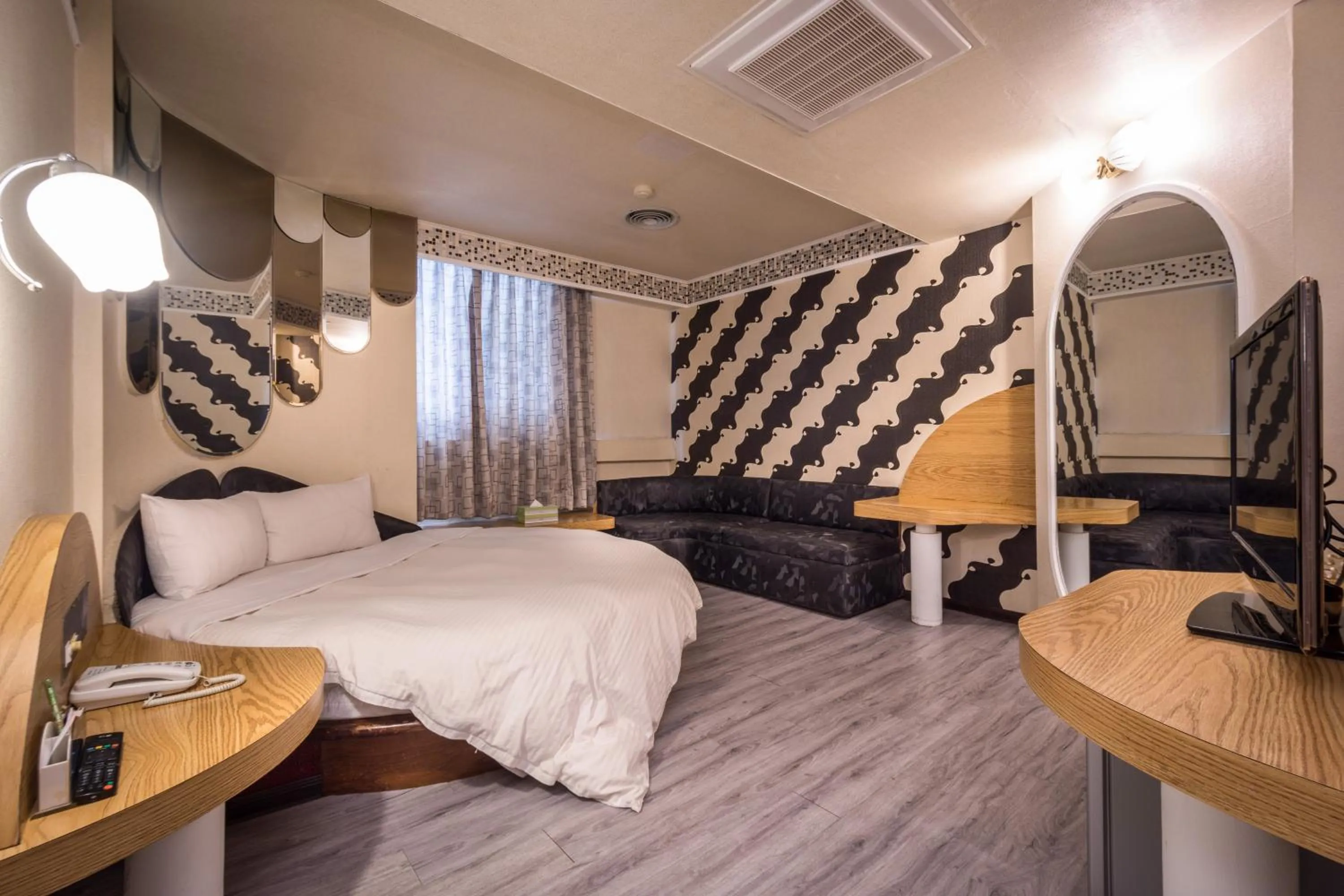 Bed in Golden Phoenix Hotel