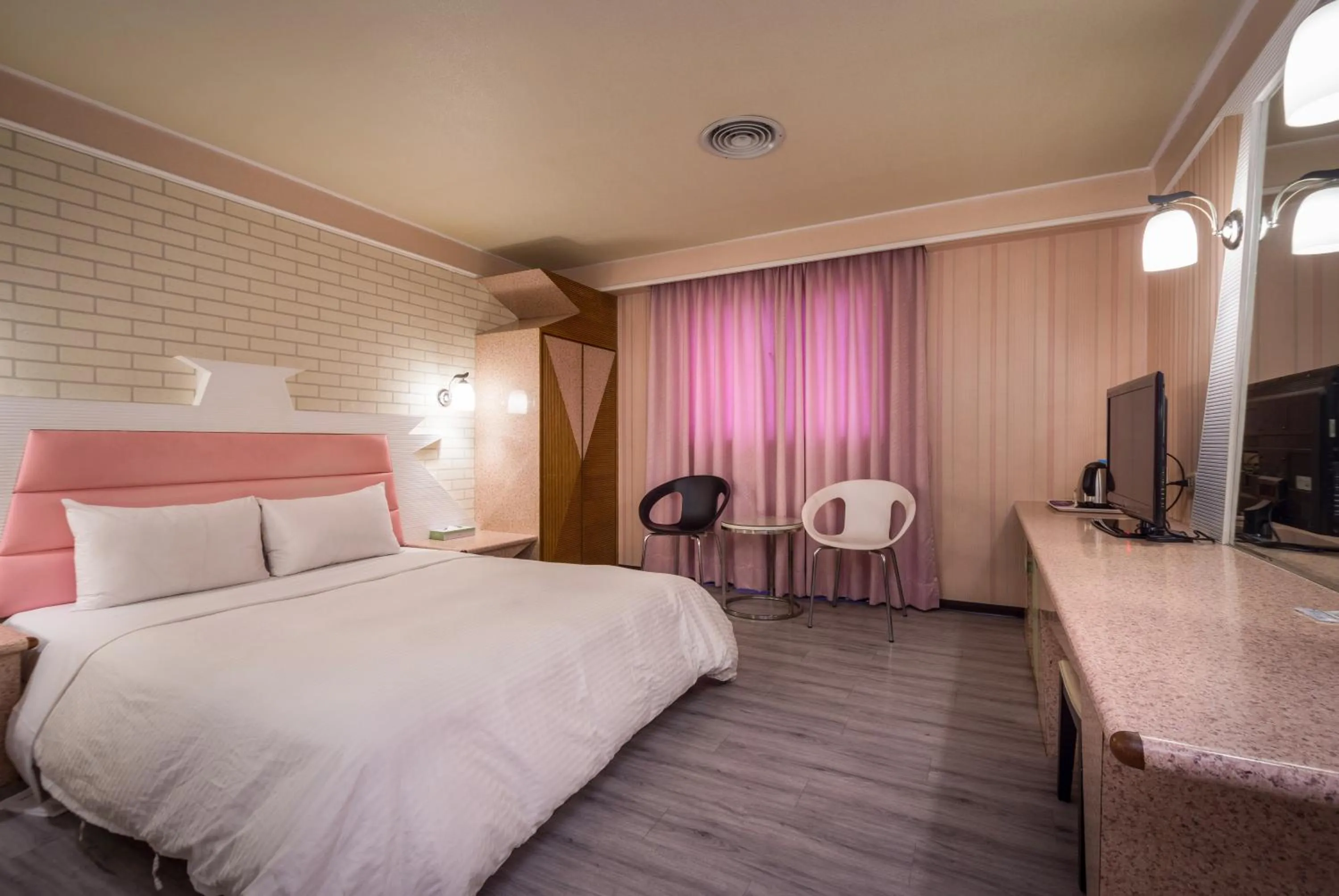 Bed in Golden Phoenix Hotel