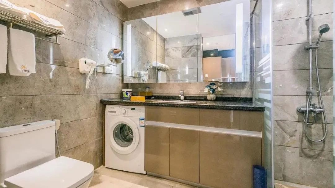 Bathroom in Green Lemon Tree International Apartment - Beijing Road Jiedeng Metropolis Branch