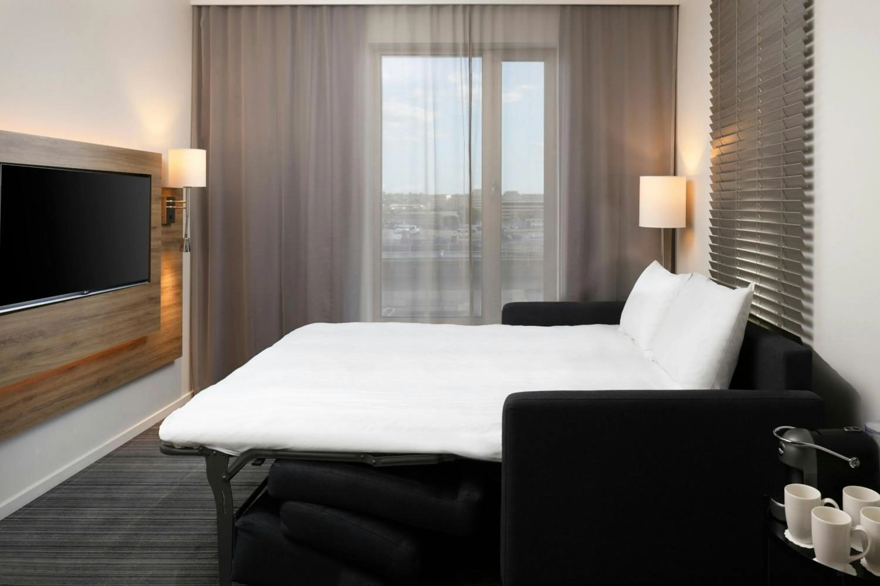 Photo of the whole room, Bed in Moxy London Excel