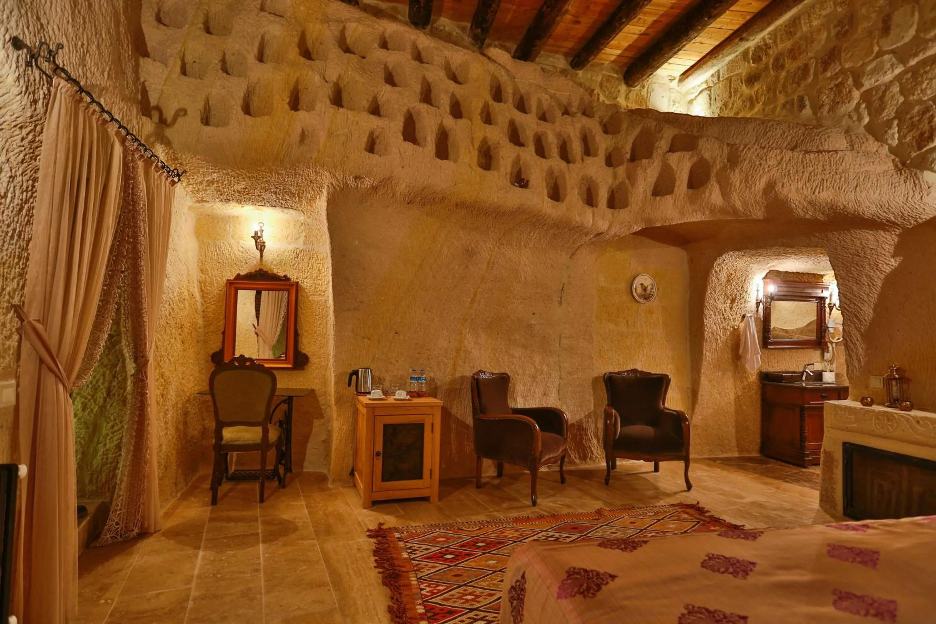 Bed in Acropolis Cave Suite