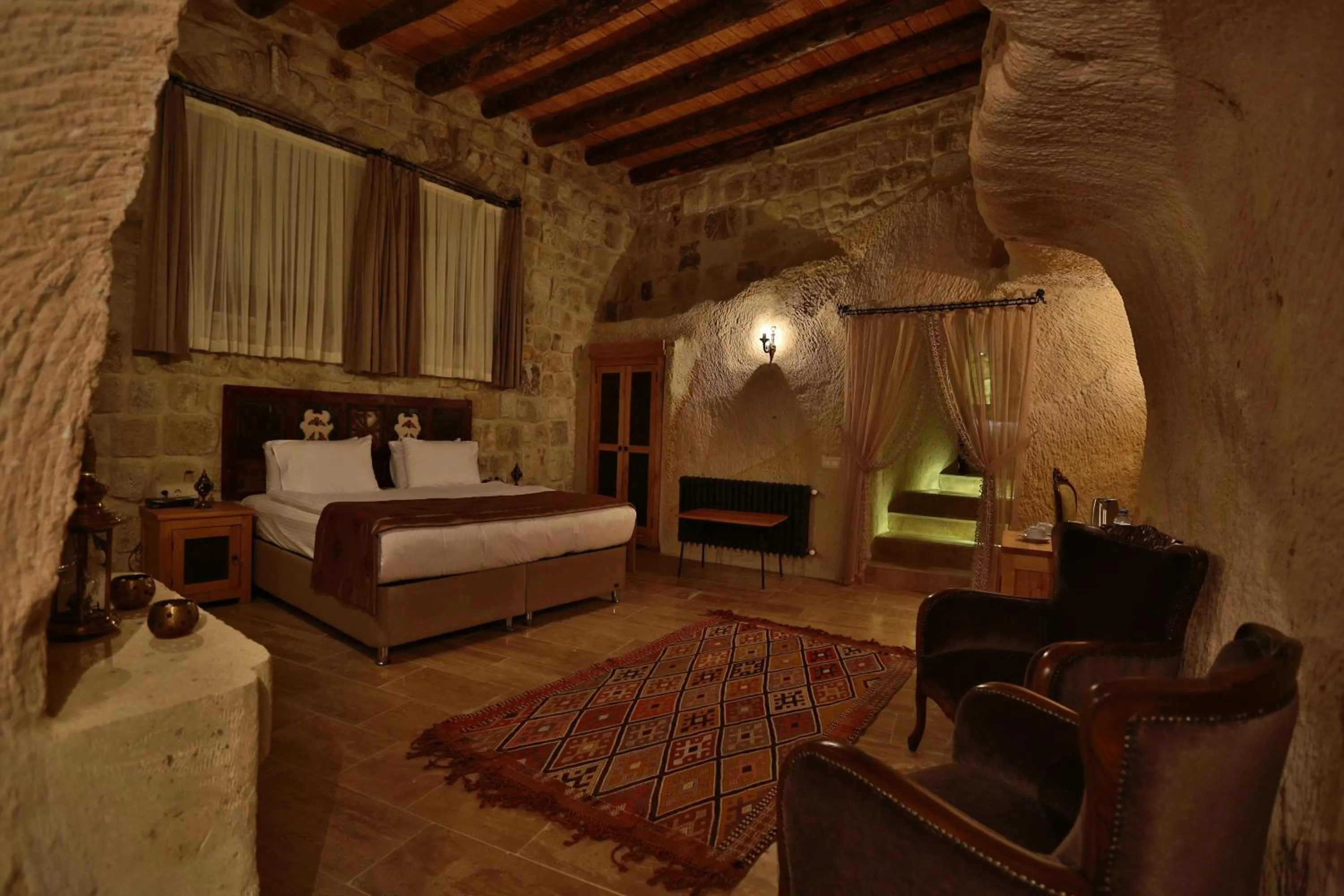 Bed in Acropolis Cave Suite