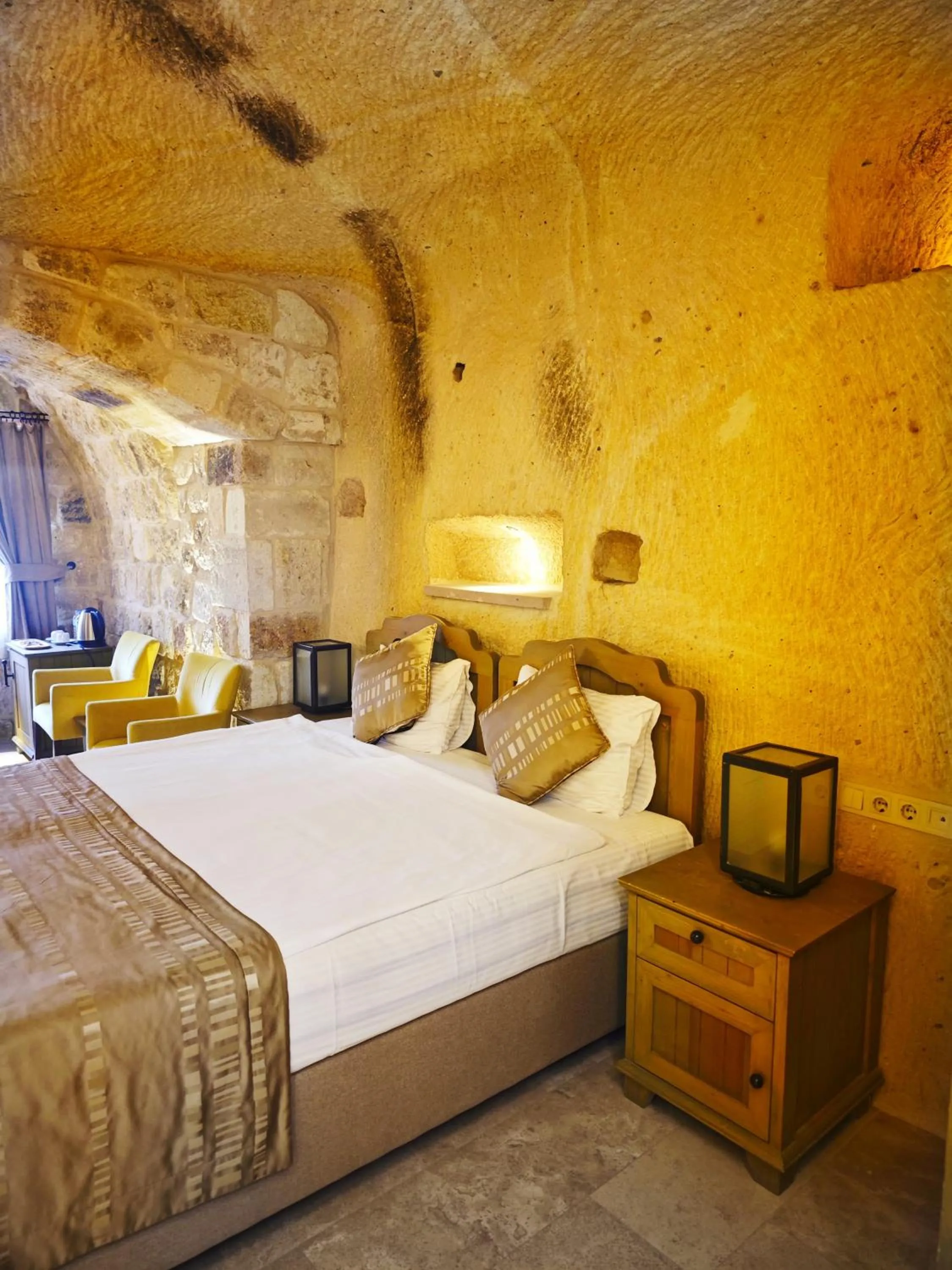Bed in Acropolis Cave Suite