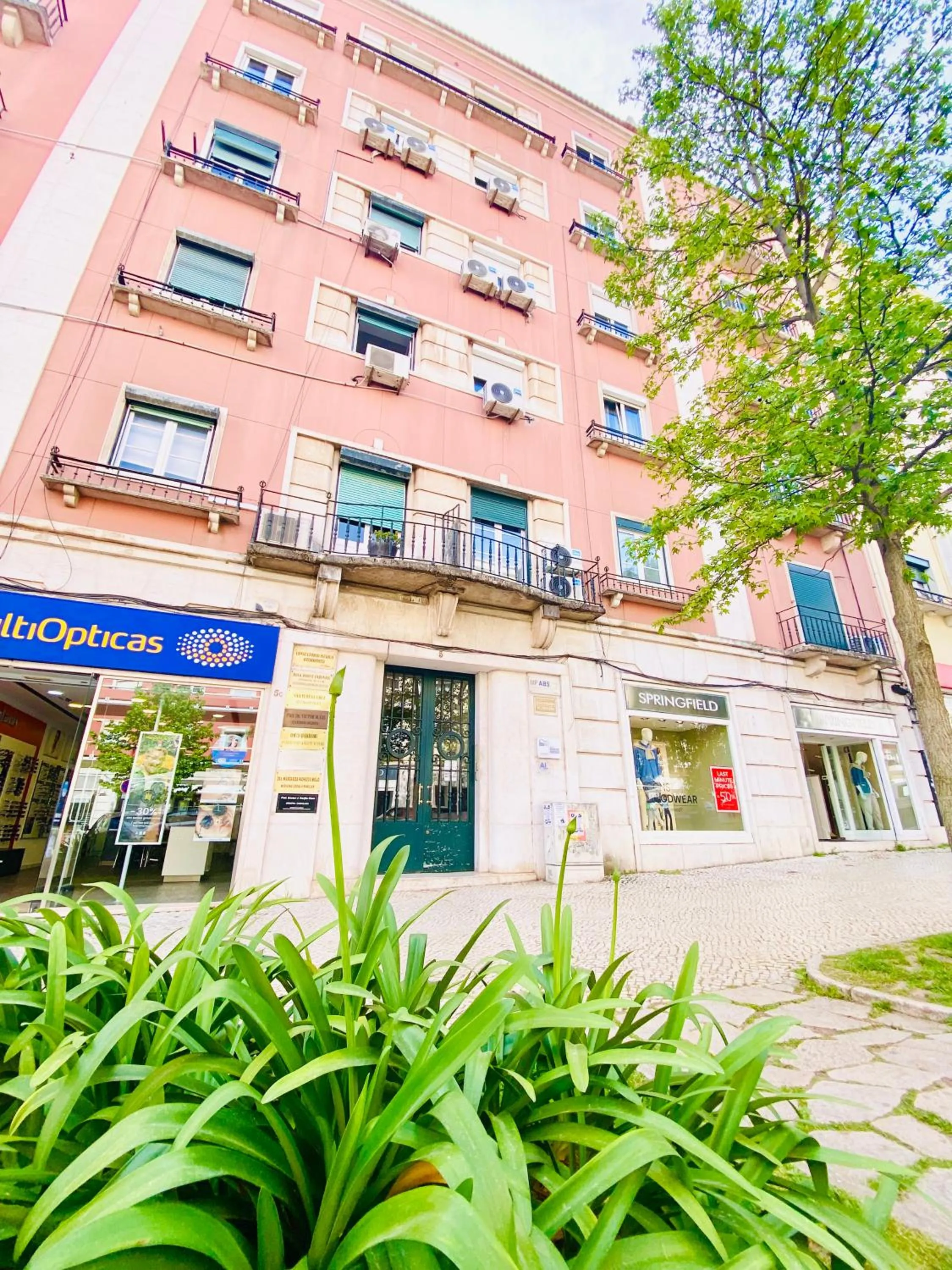 Property building in Home Out Rooms & Apartments