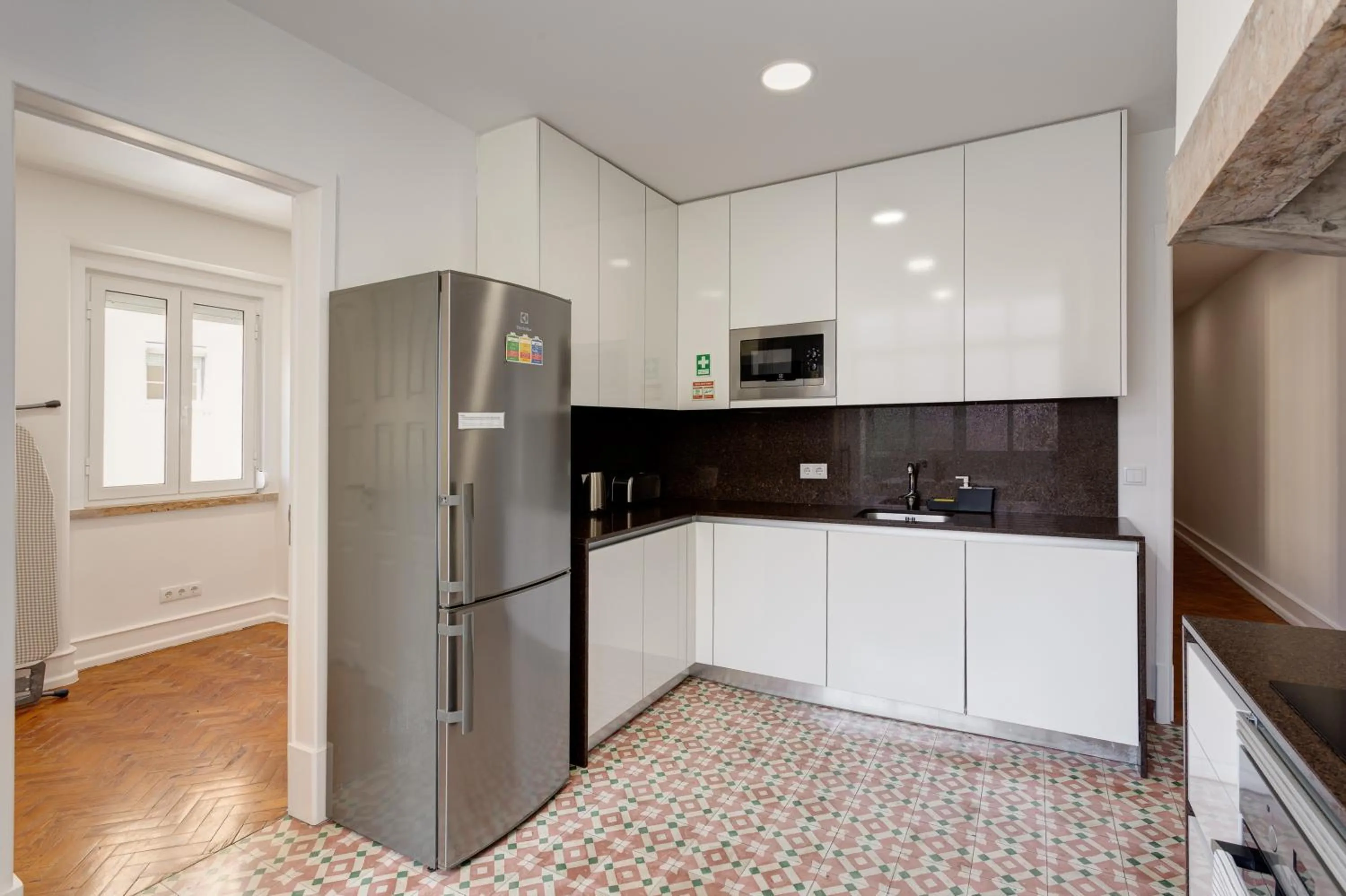 Kitchen or kitchenette in Home Out Rooms & Apartments