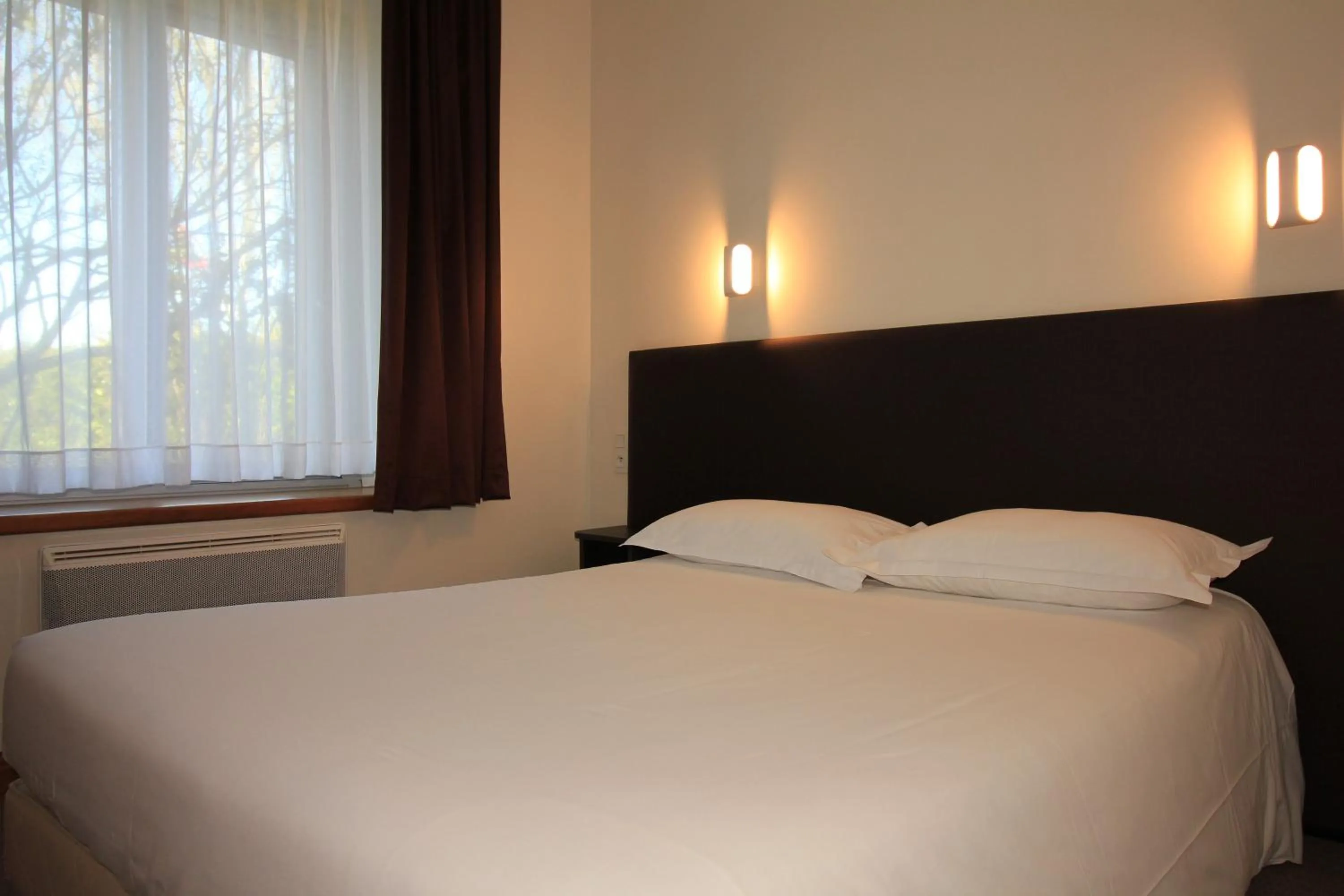 Bedroom, Bed in Logis Hôtel Lodge La Valette