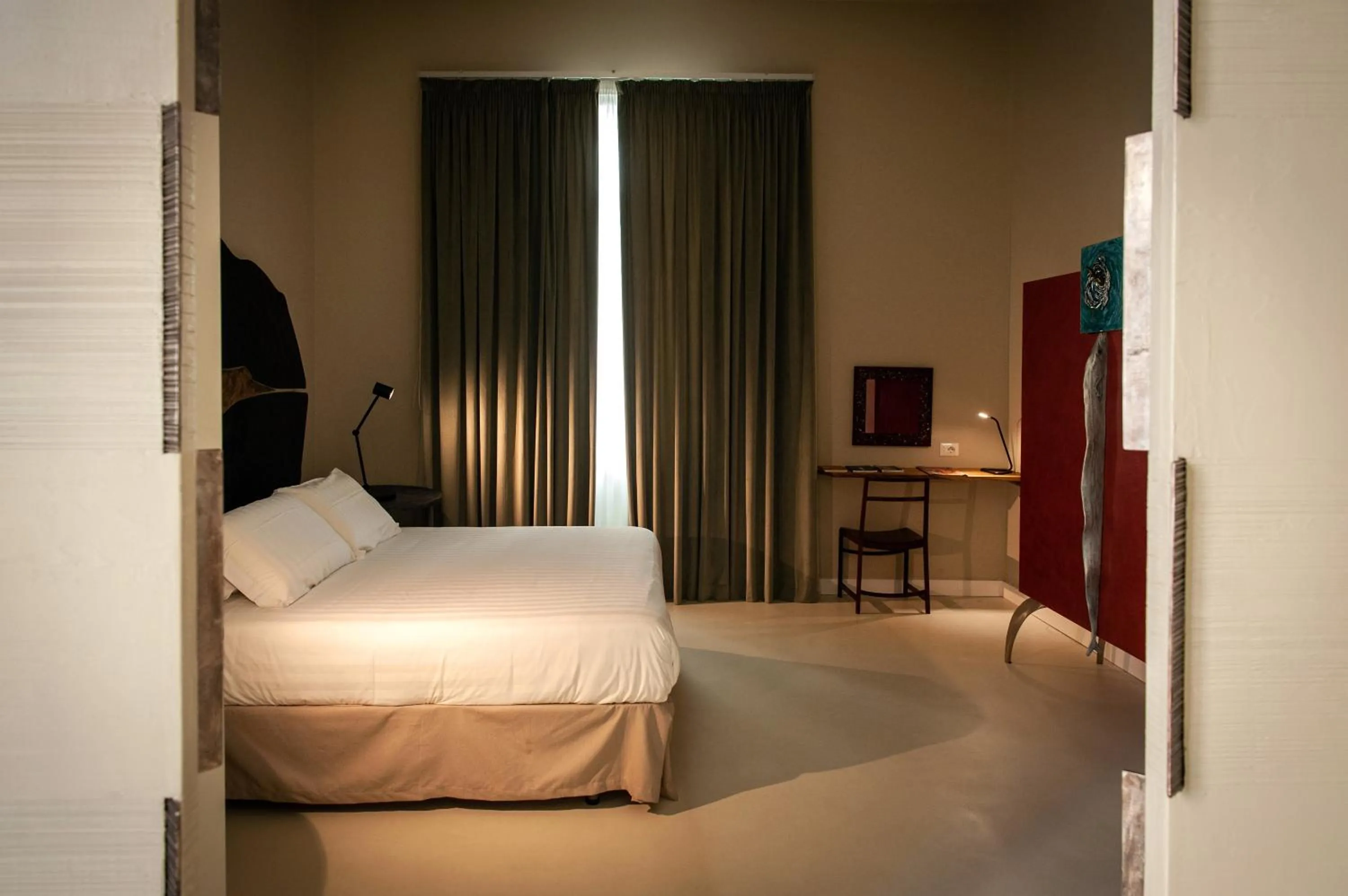 Bed in Atelier Inès Arts & Suites