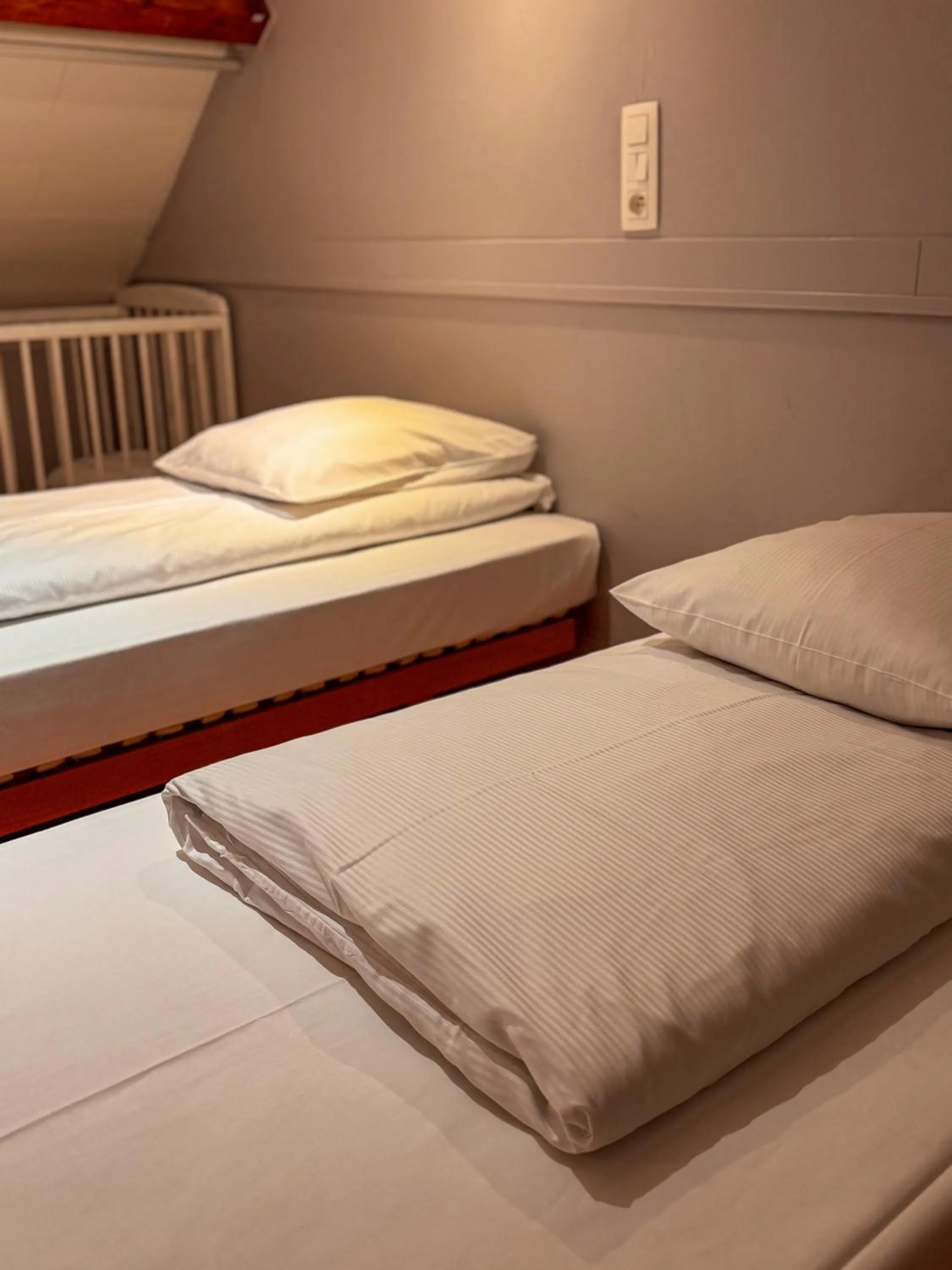 Bed in RAVeL Hotel Cyrano