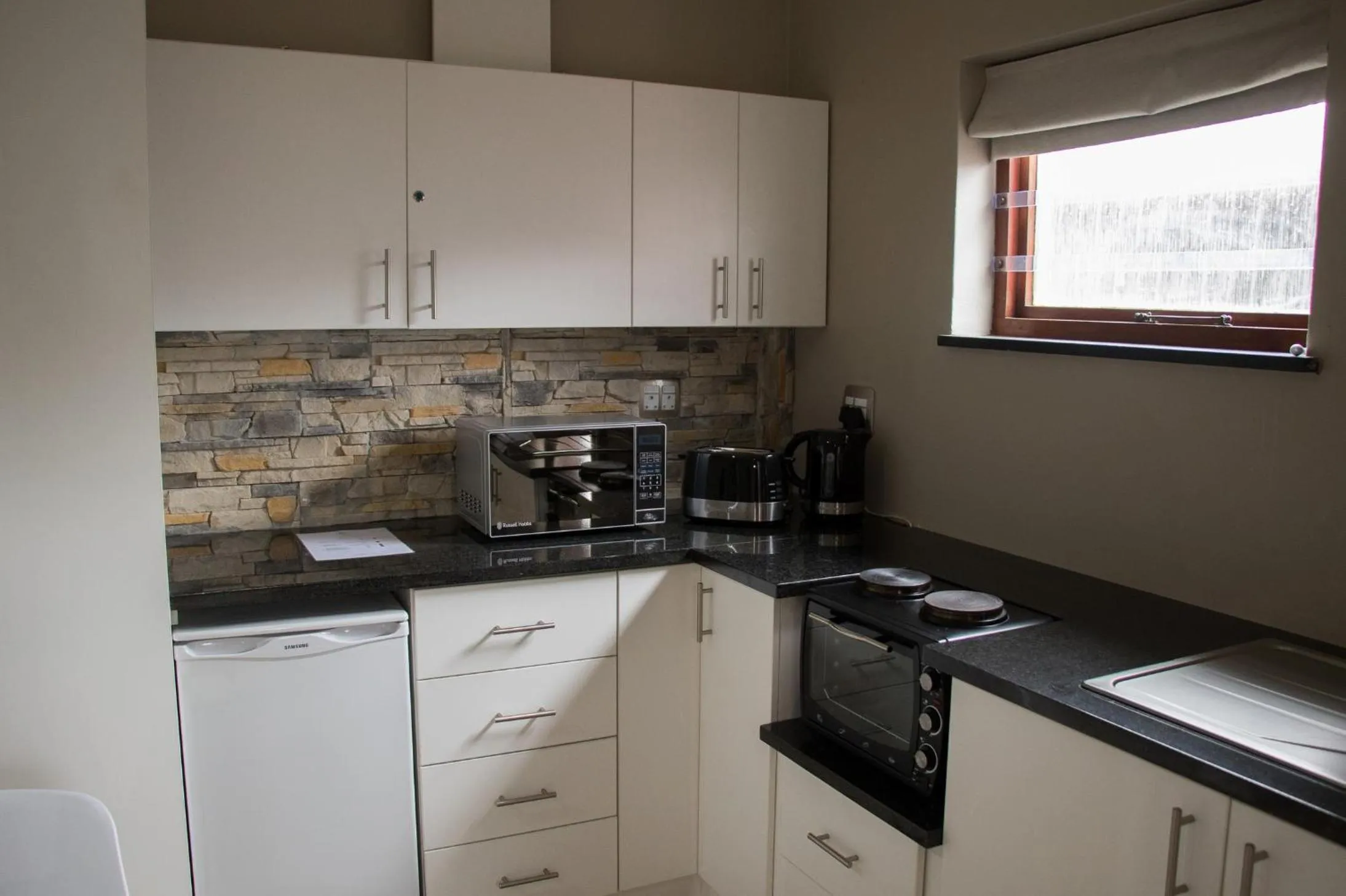 Kitchen or kitchenette in A' Queenslin Guesthouse