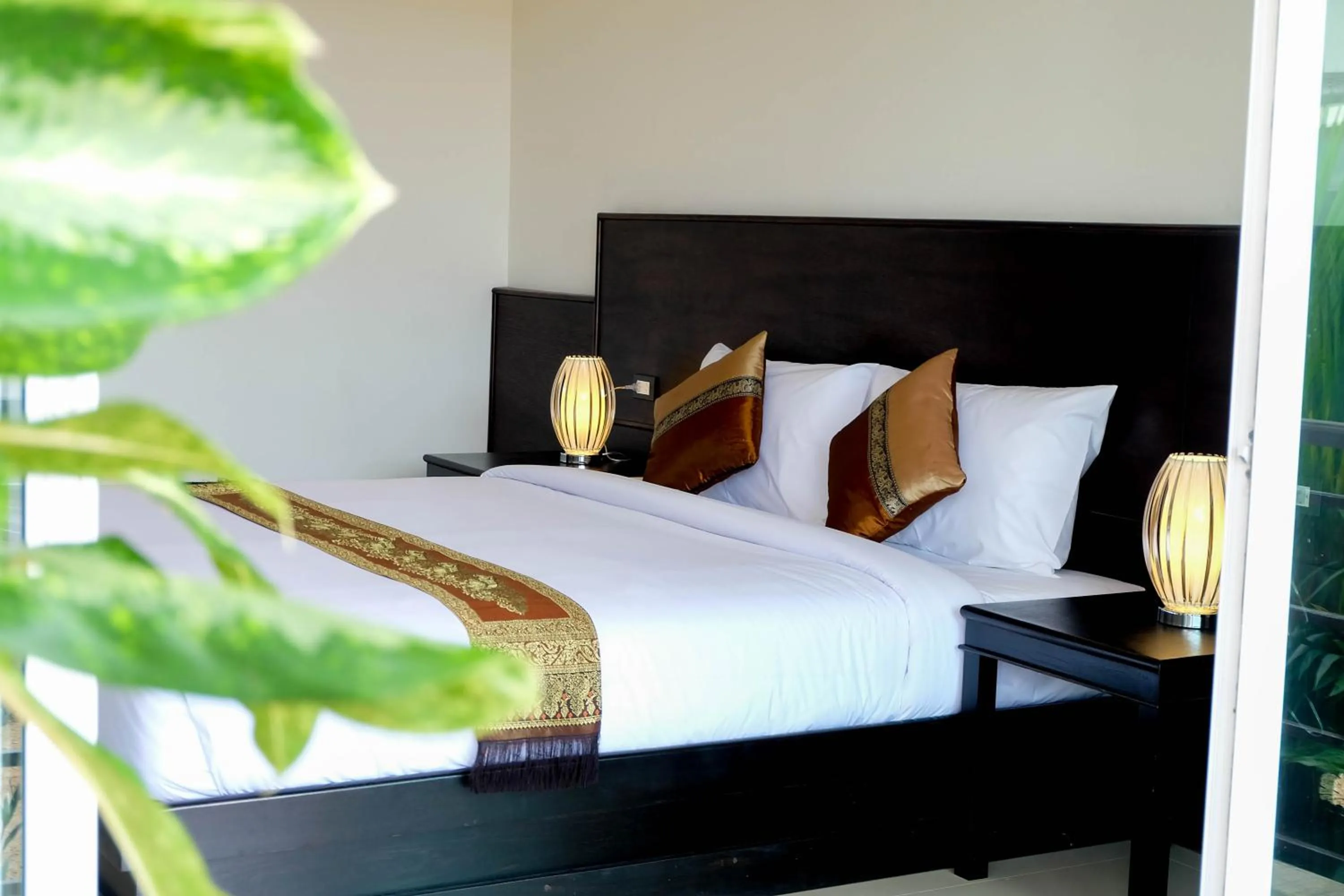 Bed in The Oasis Khaolak Resort - SHA Plus