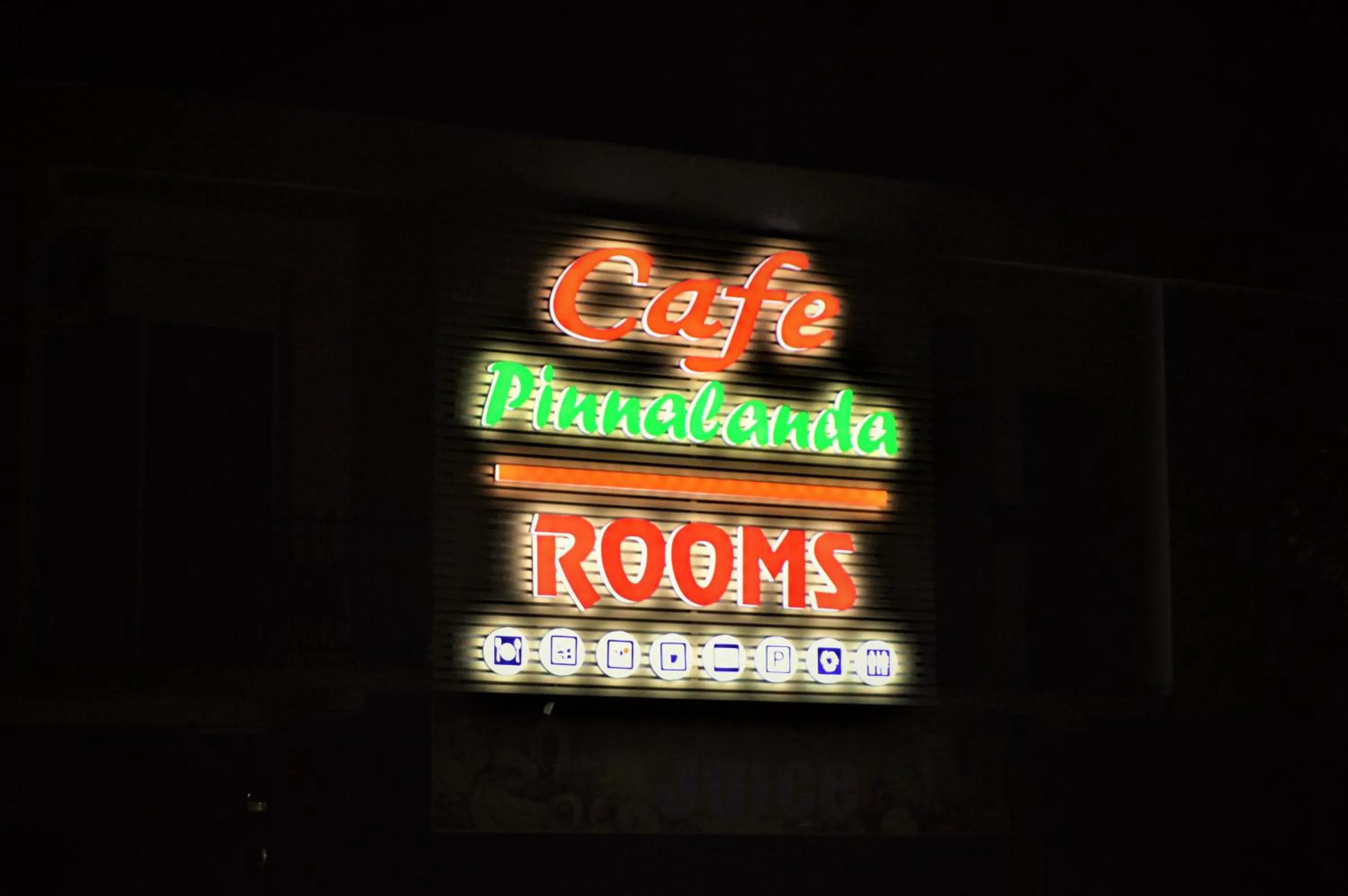 Property logo or sign in Cafe Pinnalanda