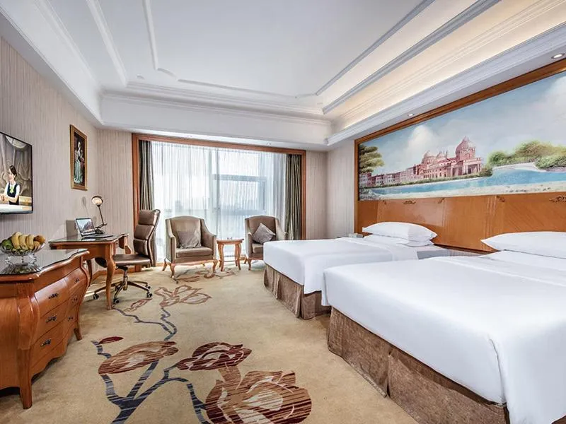 Bed in Vienna International Hotel Xinyang Yangshan New District