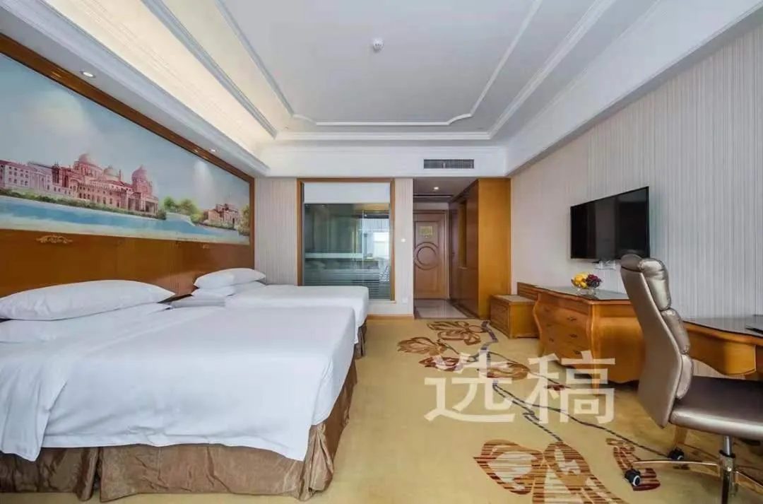 Bed in Vienna International Hotel Xinyang Yangshan New District
