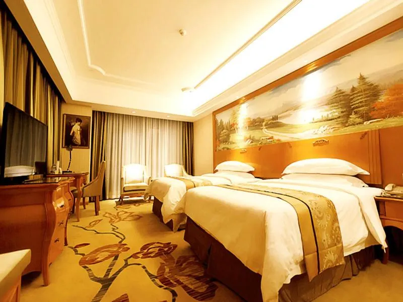 Bed in Vienna Hotel Shaoguan Wuli Pavilion