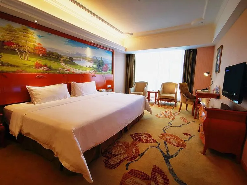 Bed in Vienna Hotel Shaoguan Wuli Pavilion