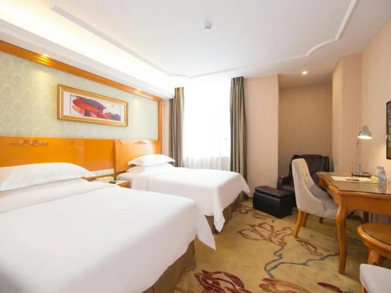 Bed in Vienna Hotel Guangzhou Nanpu Station
