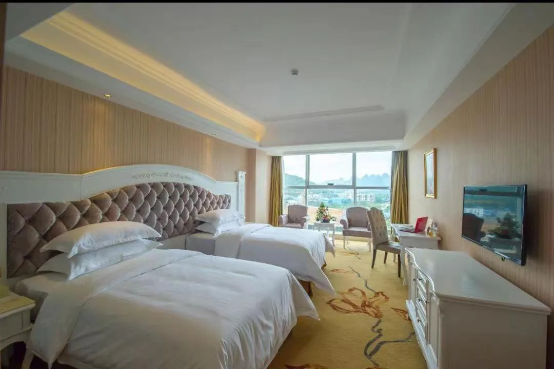 Bed in Vienna International Hotel Guilin Wanda Plaza