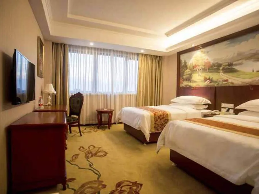 Bed in Vienna International Hotel Shanghai Fengxian Nanqiao