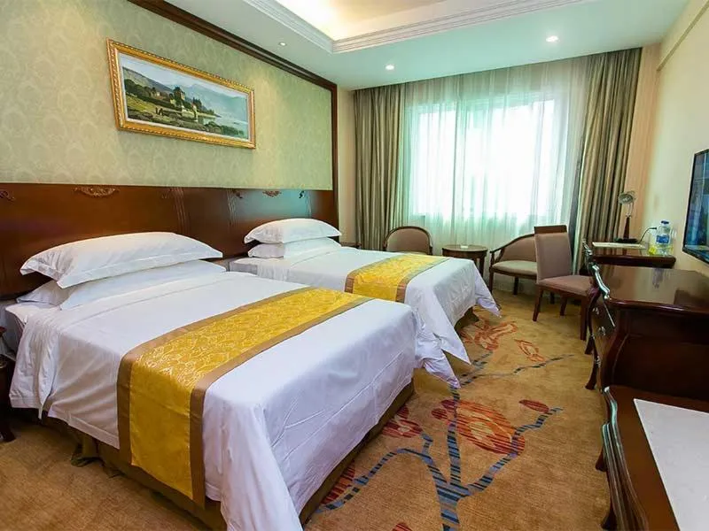 Bed in Vienna Hotel Nanjing Longjiang
