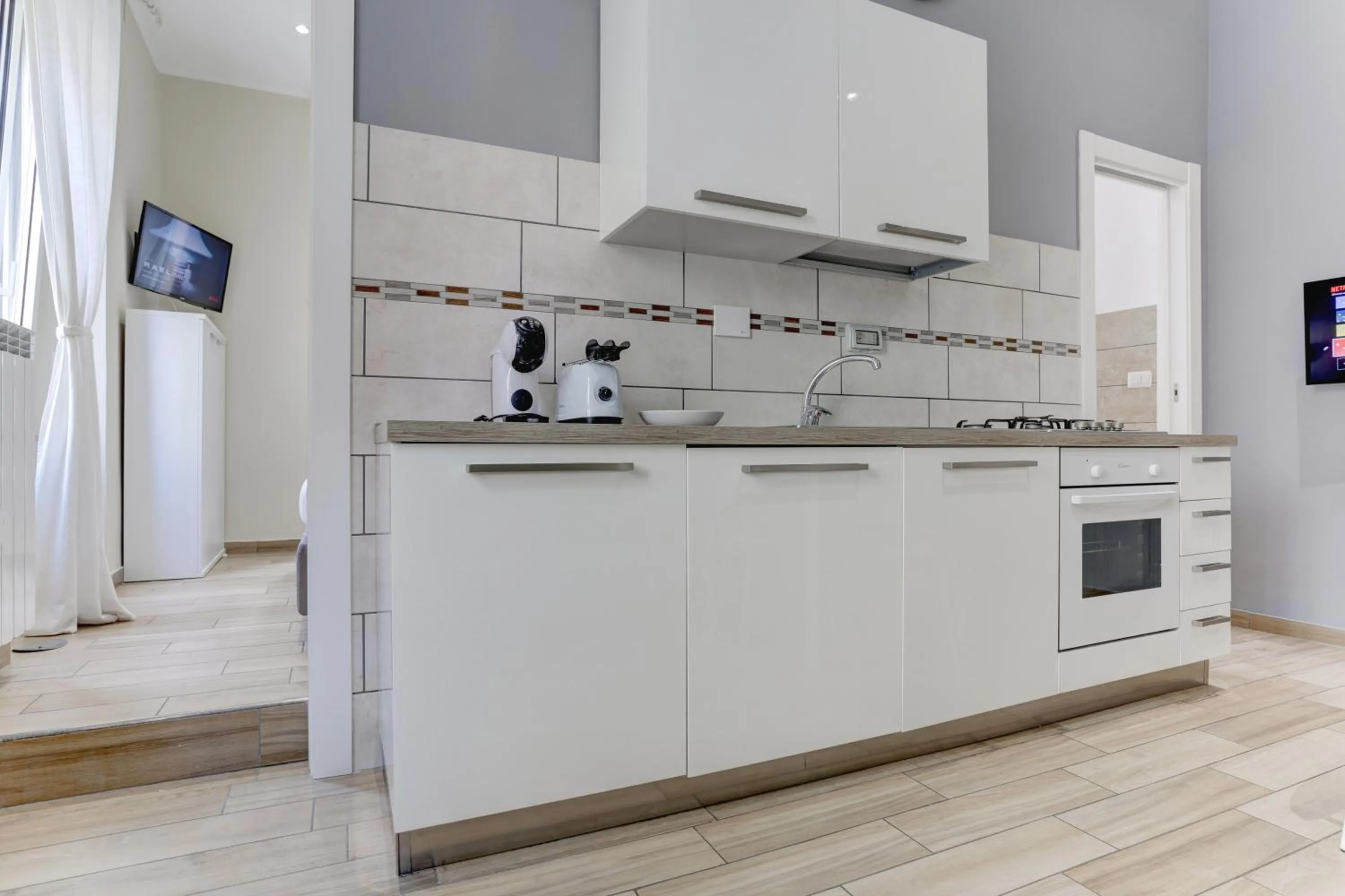 Kitchen or kitchenette in Appartamento Santi Quattro - Colosseo