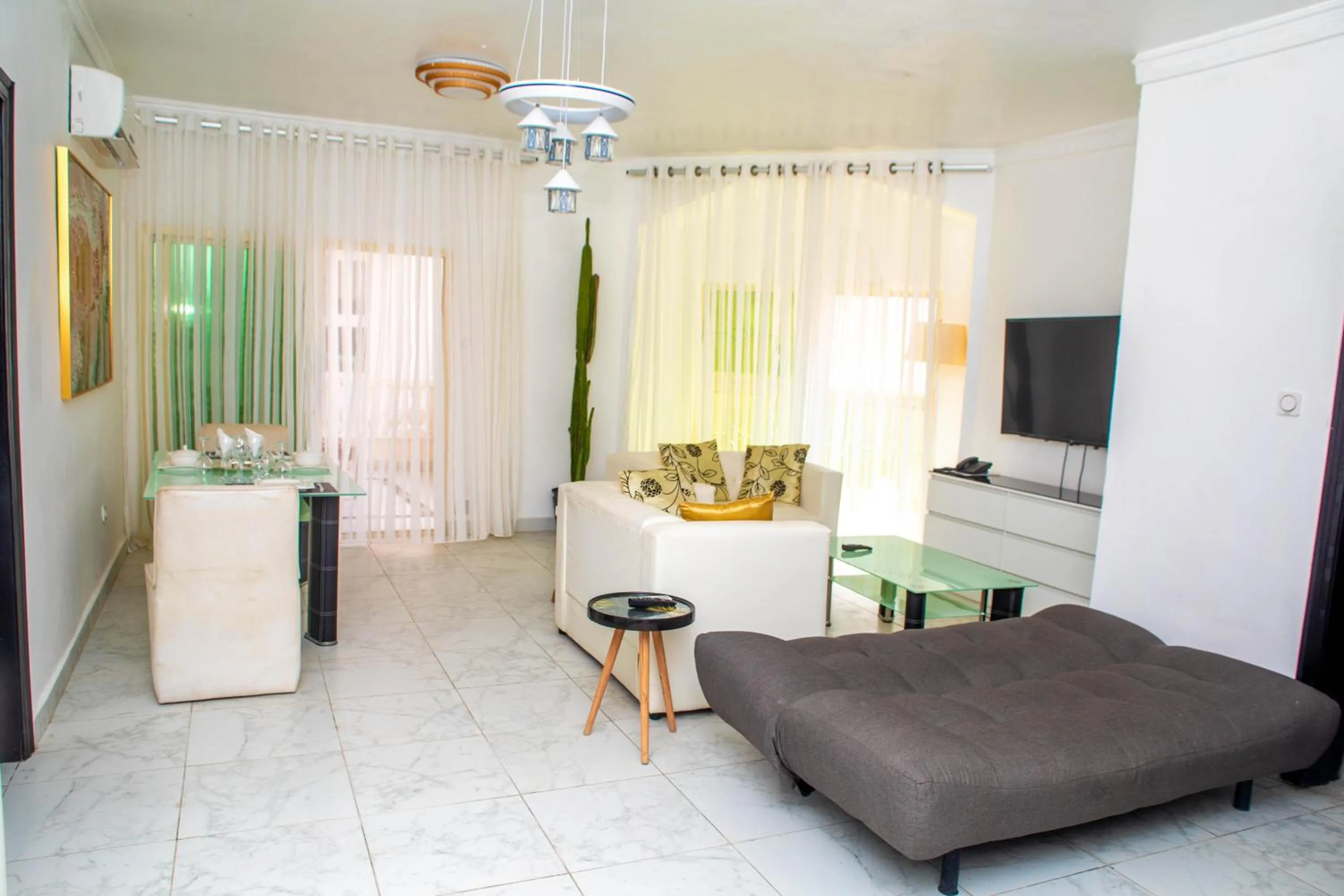 Seating area, Bed in Hotel Les Orchidées