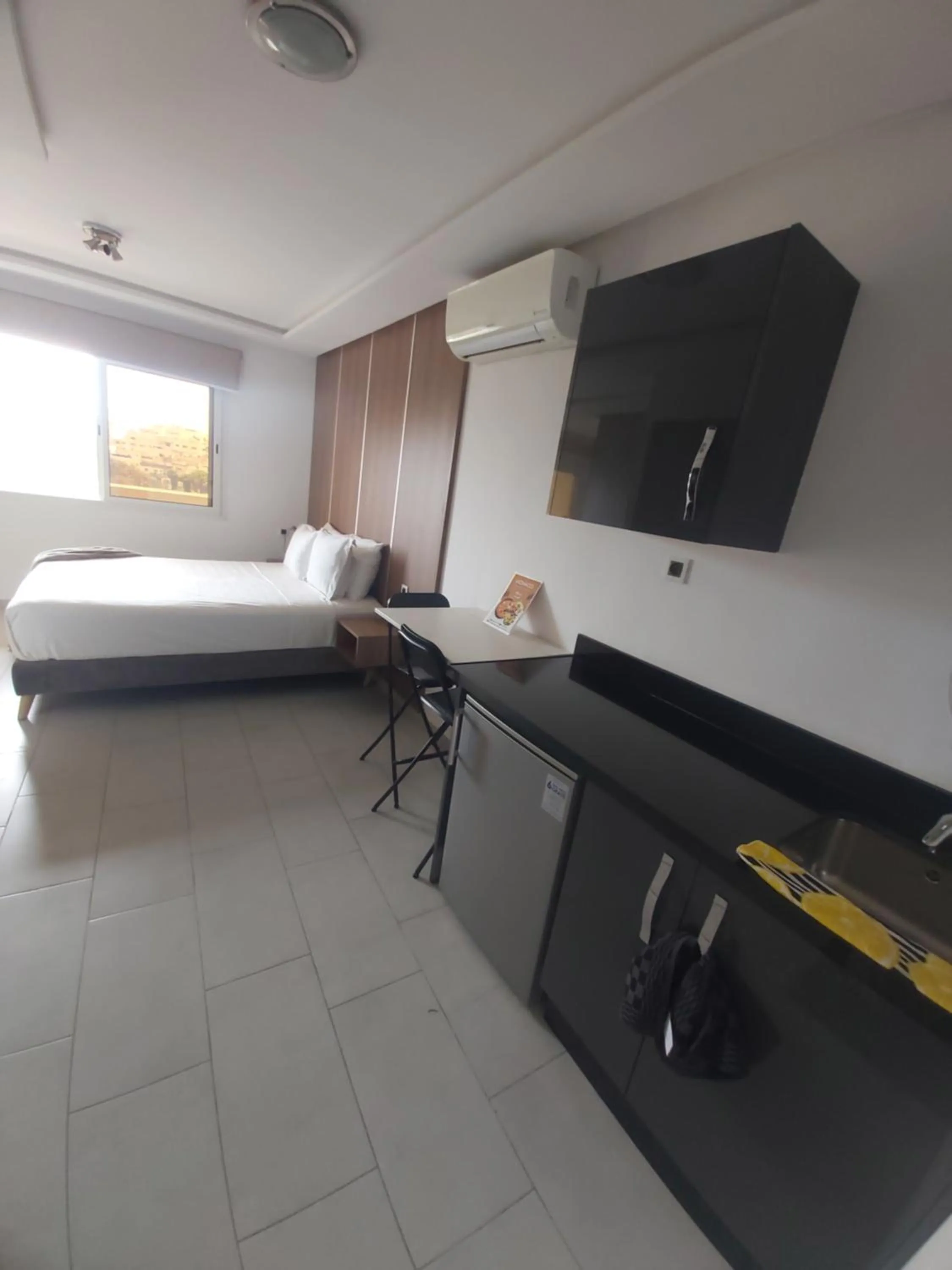 Bed in Appart Hotel Monaco