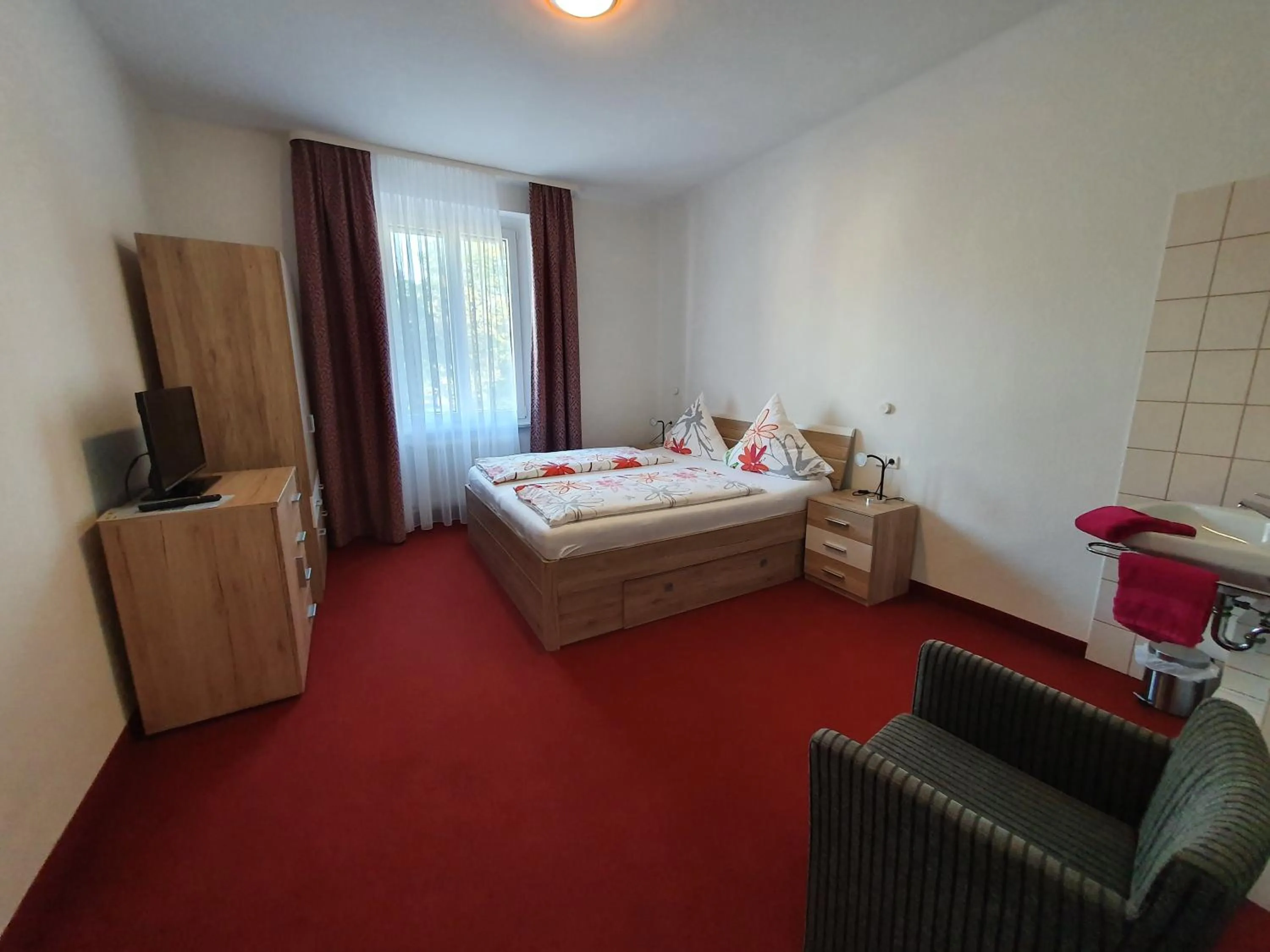 Photo of the whole room, Bed in Hotel Neuenburger Hof