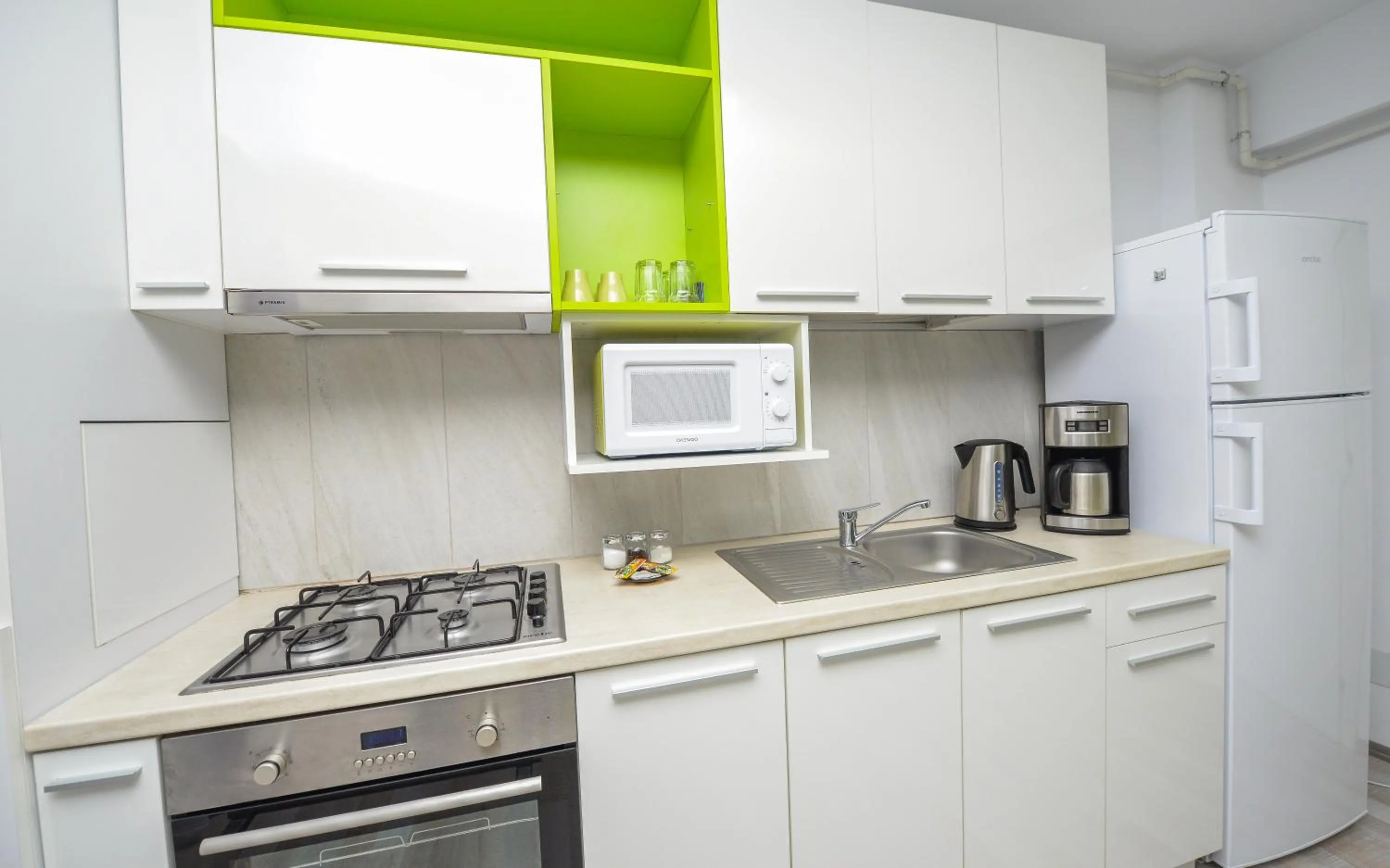 Kitchen or kitchenette in Harmony Suites