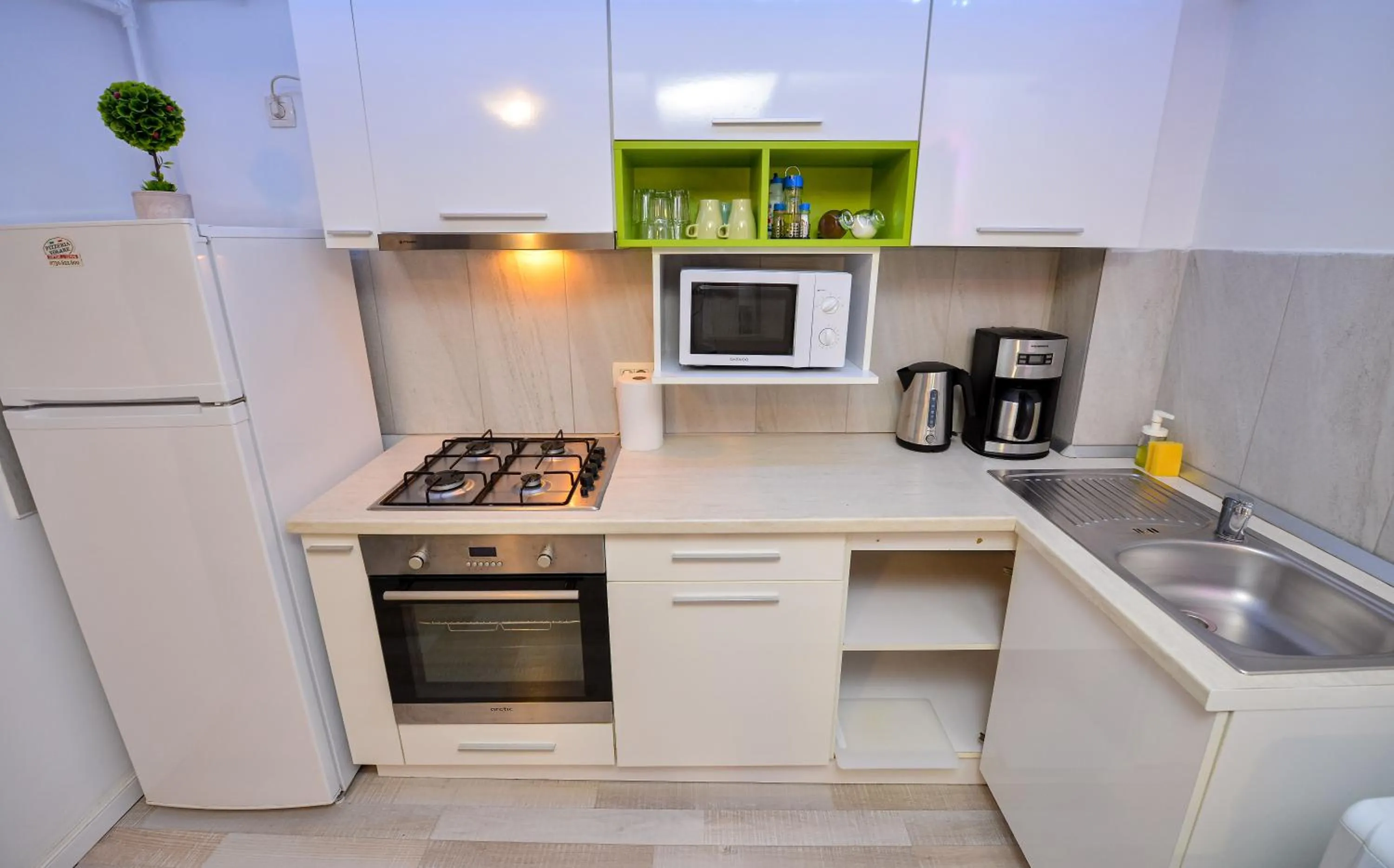 Kitchen or kitchenette in Harmony Suites